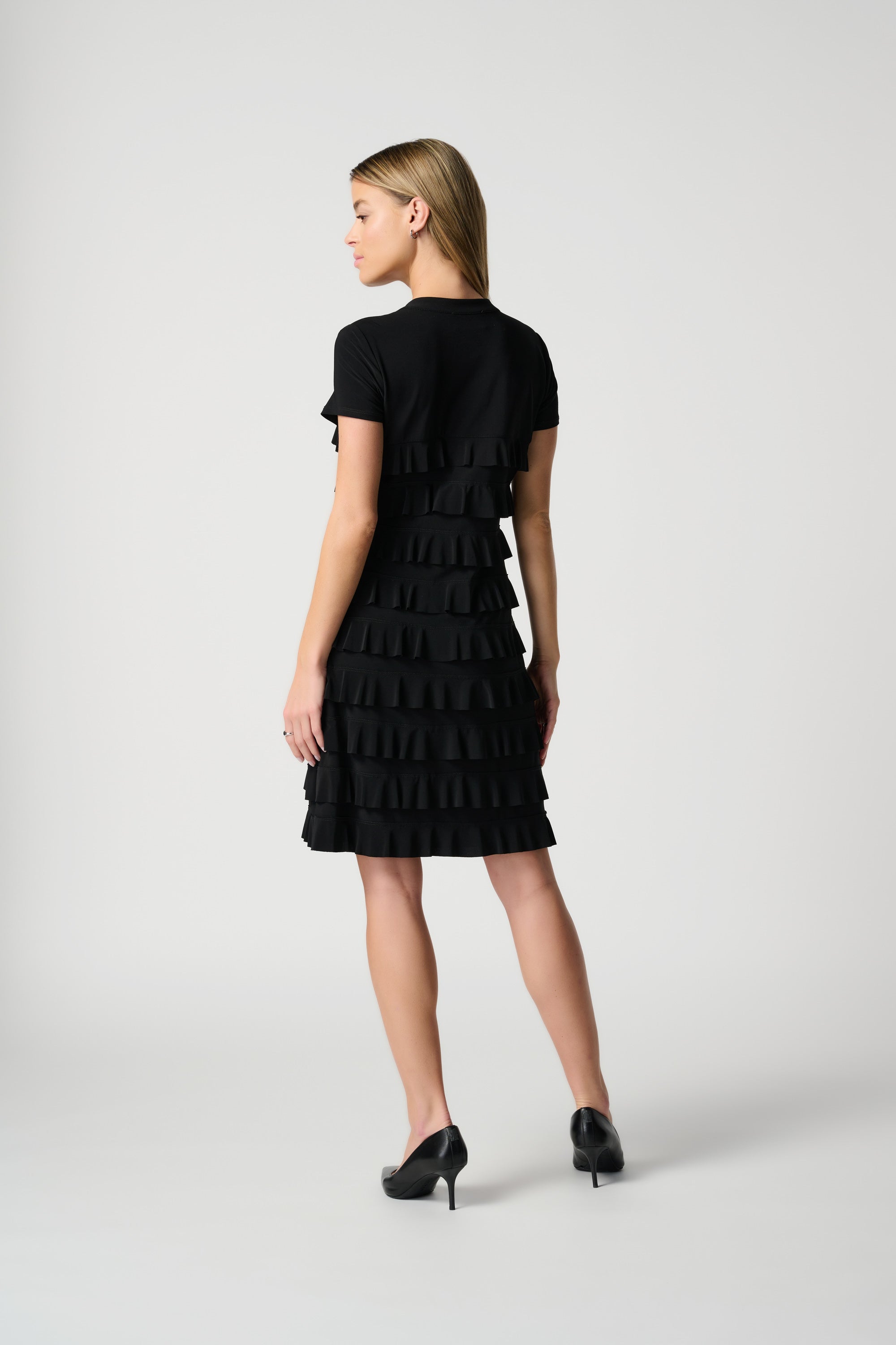 Back view of Joseph Ribkoff (211350NOS) Women's Short Sleeve Knee Length Dress With Stand Collar and Ruffle Detailing in Black