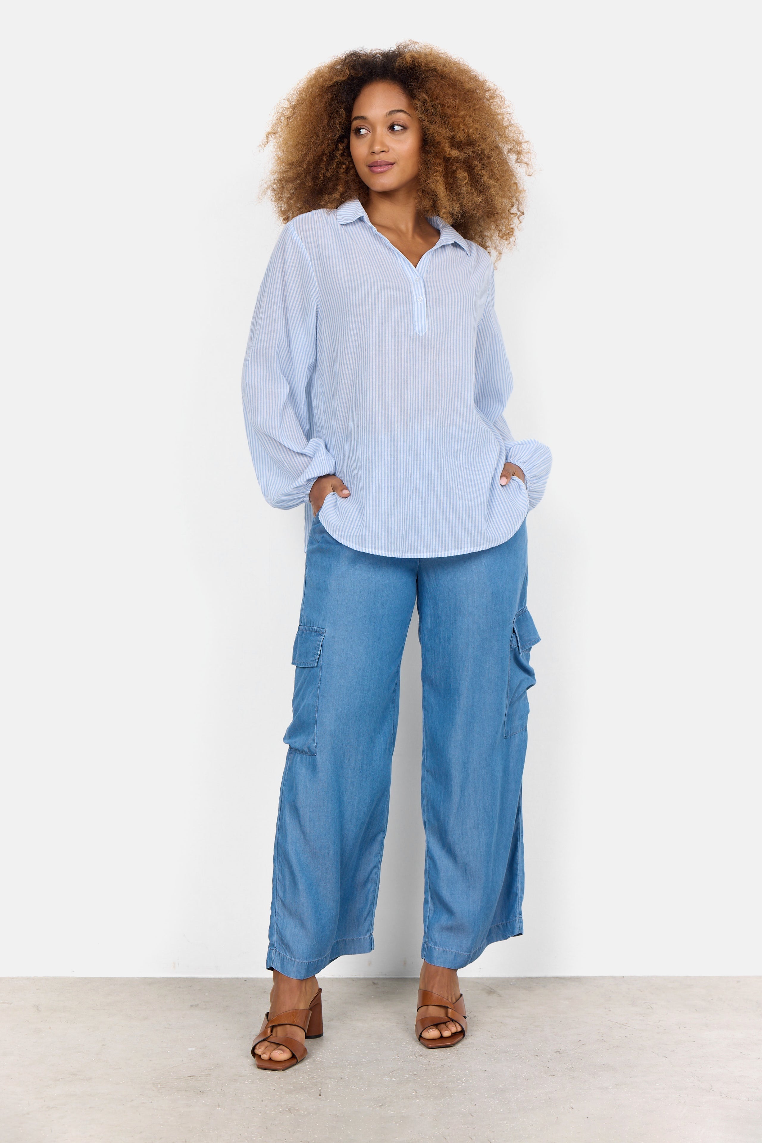 Full body view of Soya Concept (40523) Women's Long Puff Sleeve Split V Shirt in Light Blue & White Vertical Stripe Print