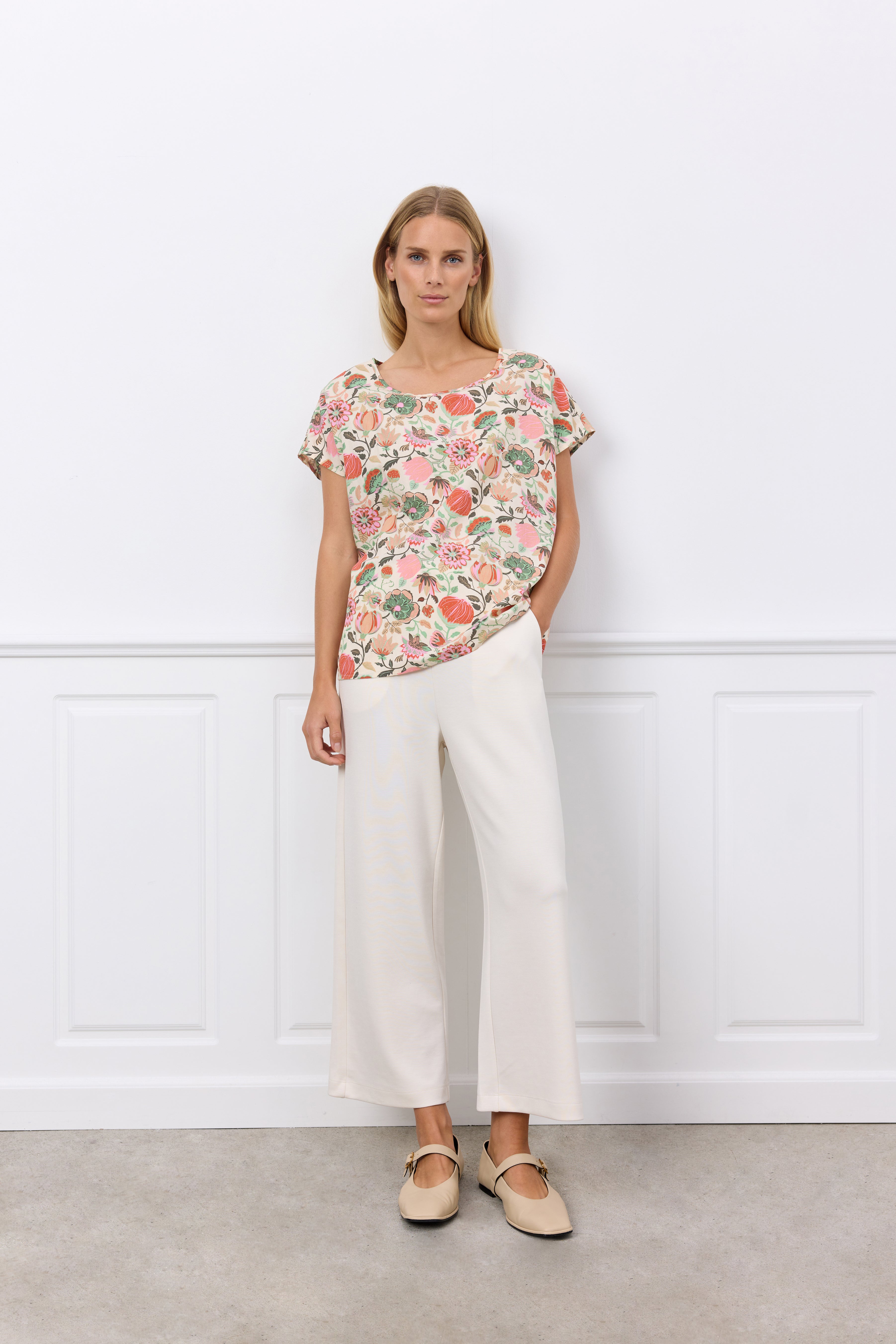Soya Concept (40579) Women's Short Sleeve Graphic Floral Blouse in a Peach Floral Print With PInk & Green Hues over a Cream Background 