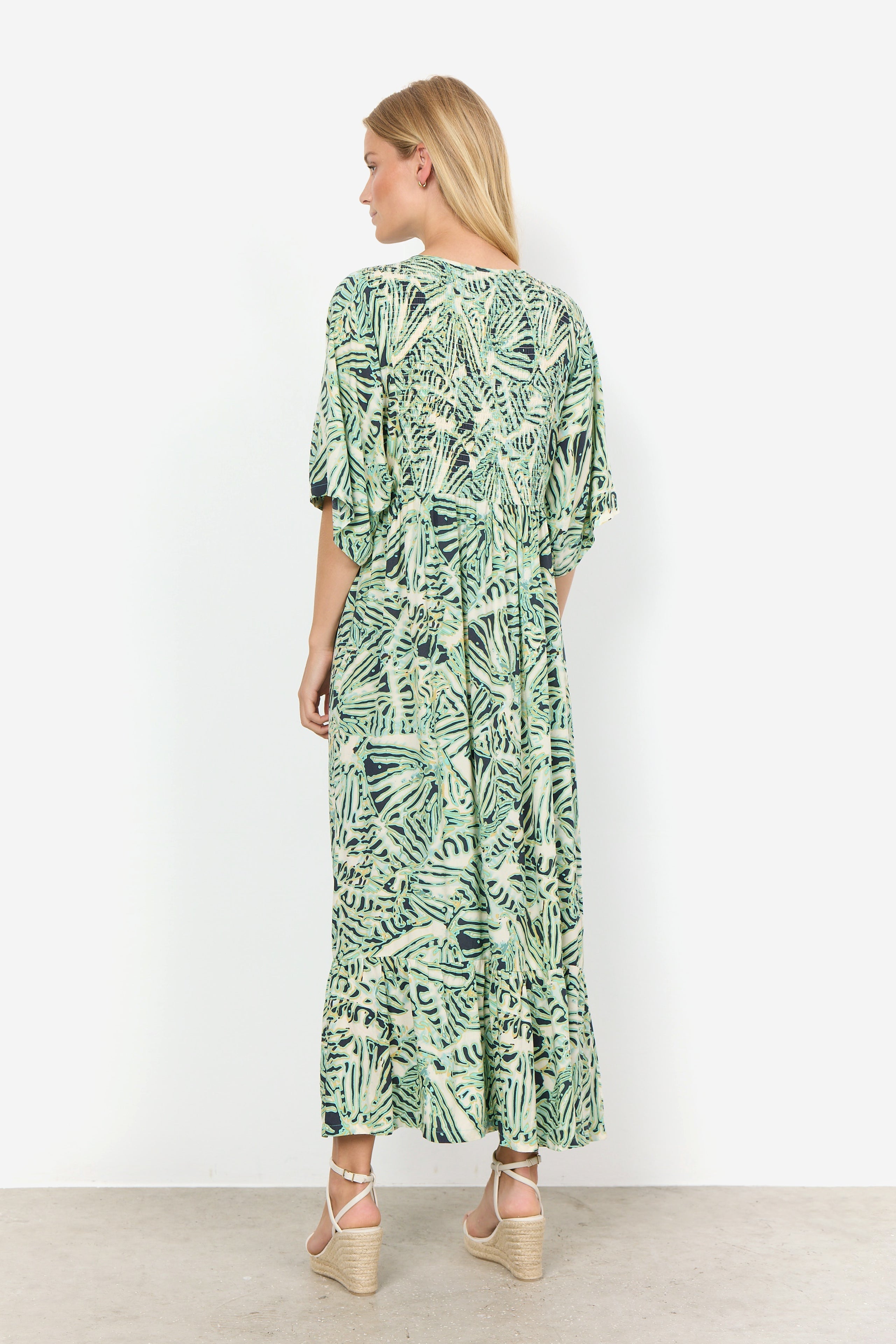 Back view of Soya Concept (40629) Women's Short Sleeve Aqua Foliage Printed Maxi Dress with V-neck and smocked bodice