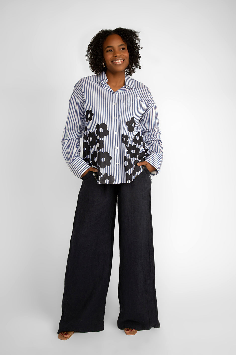 Carre Noir (6866) Women's Long Sleeve Blue & White Striped Button Up Shirt With Black Flowers along the front hem and lower half of the top