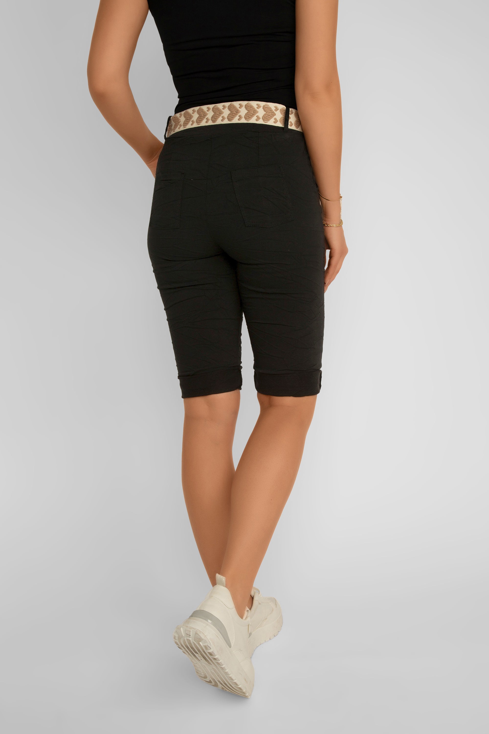 Back view of Elissia (L21139) Women's Crinkle Fabric Bermuda Shorts With Heart Belt and Rolled Hem in Black