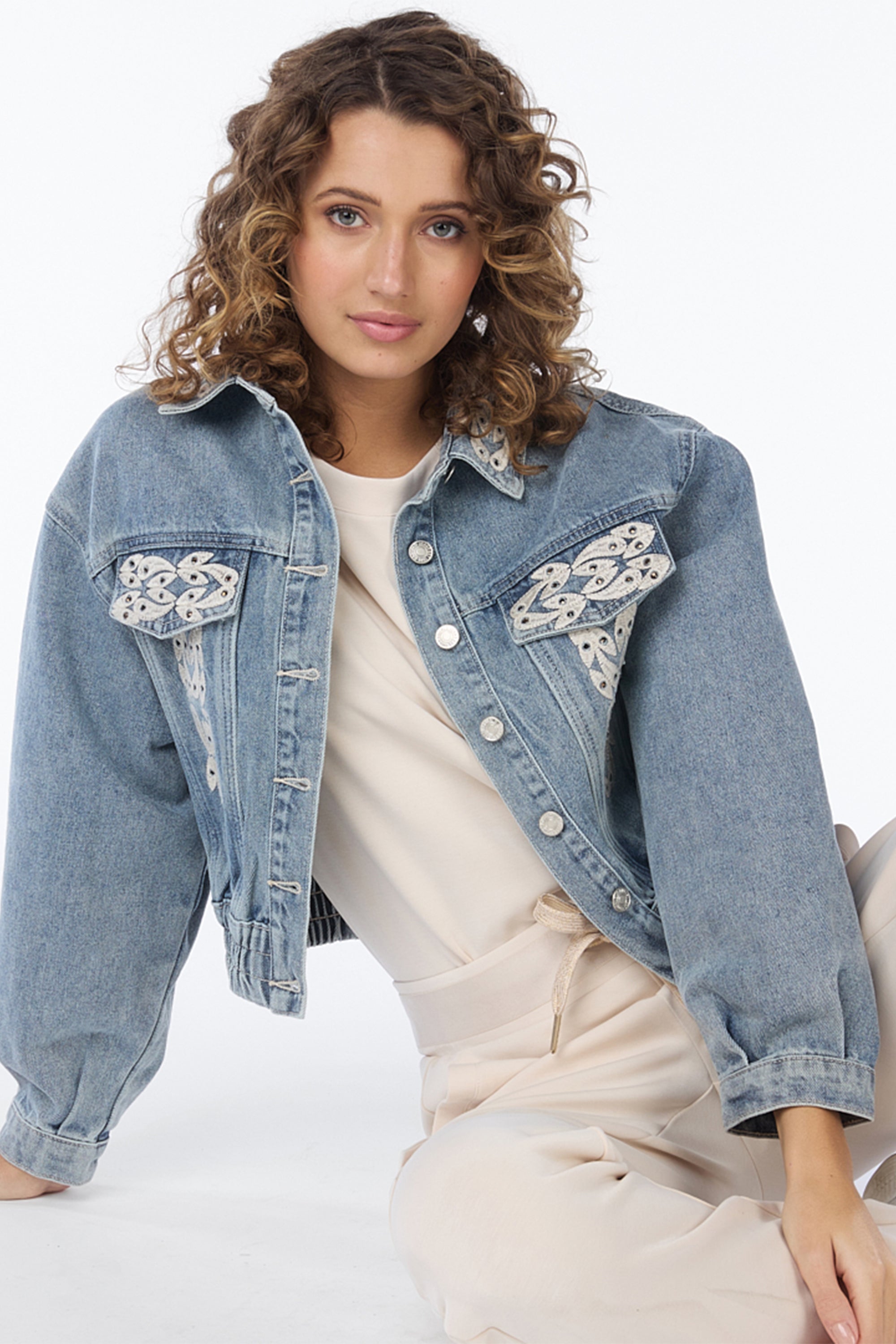 Front view of Esqualo (SP2412002) Women's Long Sleeve Cropped Blue Jean Jacket With Embroidery & Rhinestones on Collar and Front Panels