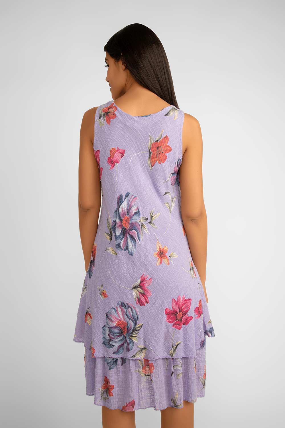 Back view of Me & Gee (S24-16-HL8903) Women's Sleeveless Floral Gauze Dress With Layered Knee Length Skirt in Lilac Purple with Floral Print