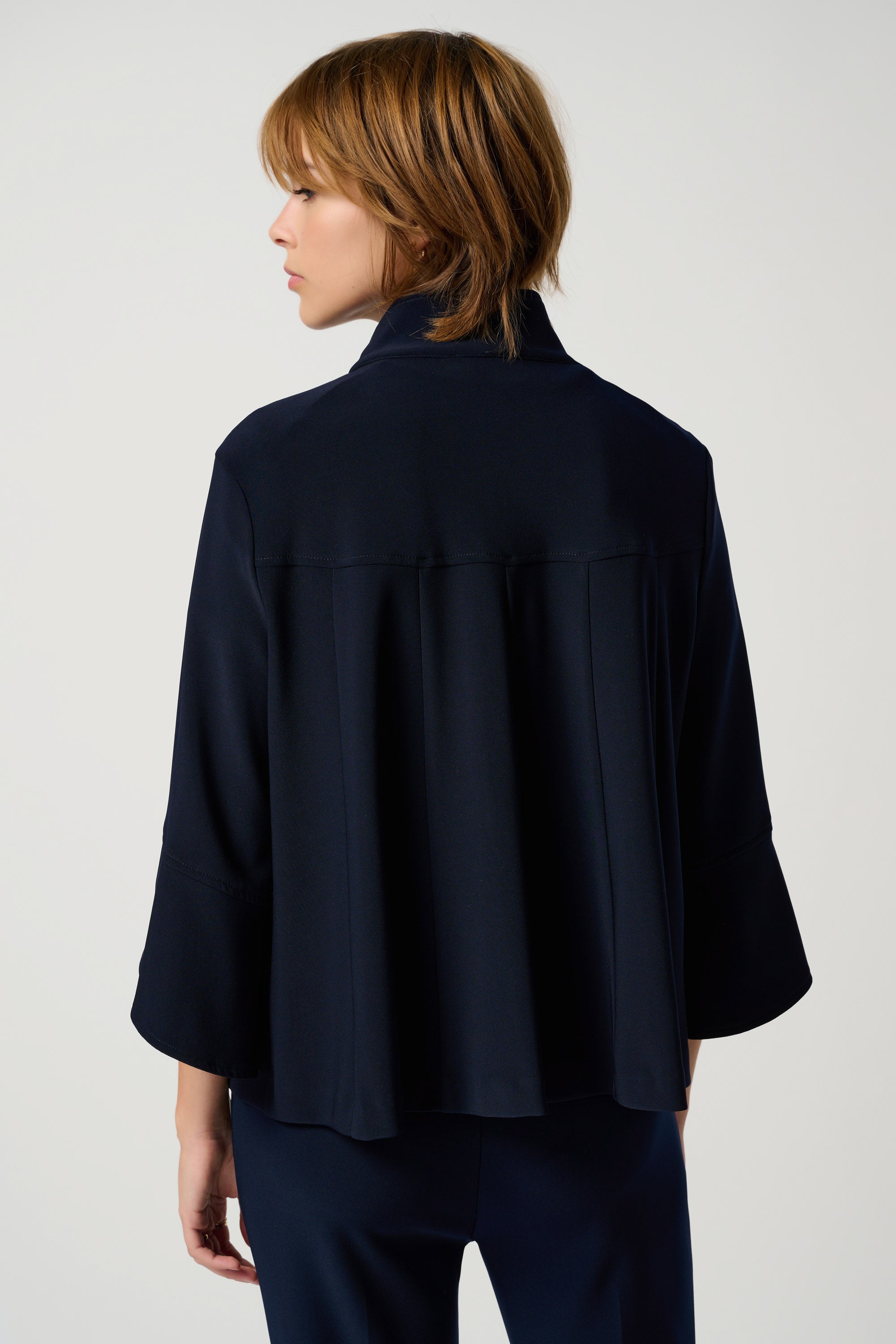 Back view of Joseph Ribkoff (193198NOS) Women's 3/4 Sleeve Classic Trapeze Jacket with Stand Collar & Statement Button in Midnight Navy Blue