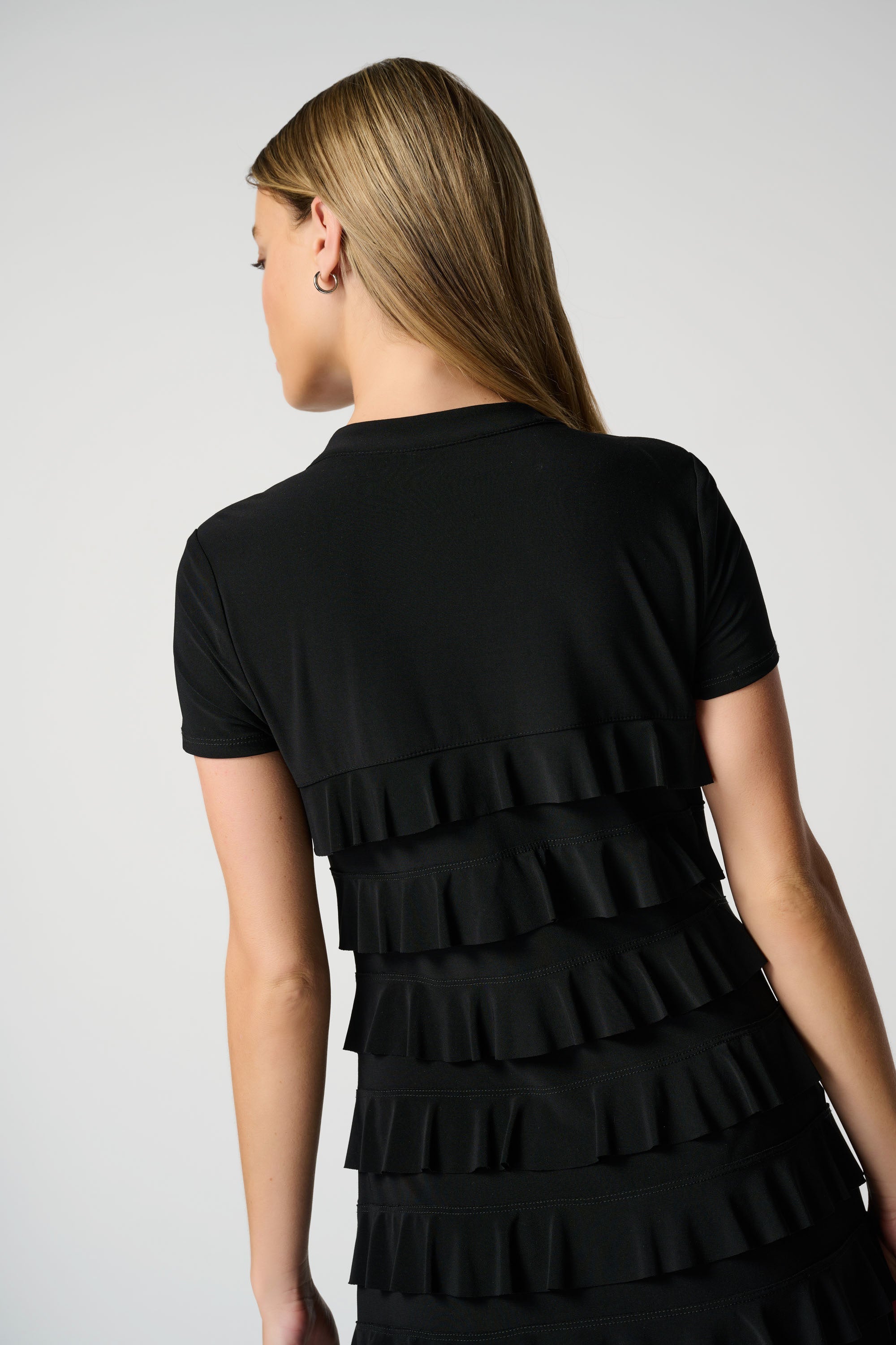 Back close up of ruffle detail on Joseph Ribkoff (211350NOS) Women's Short Sleeve Knee Length Dress With Stand Collar and Ruffle Detailing in Black