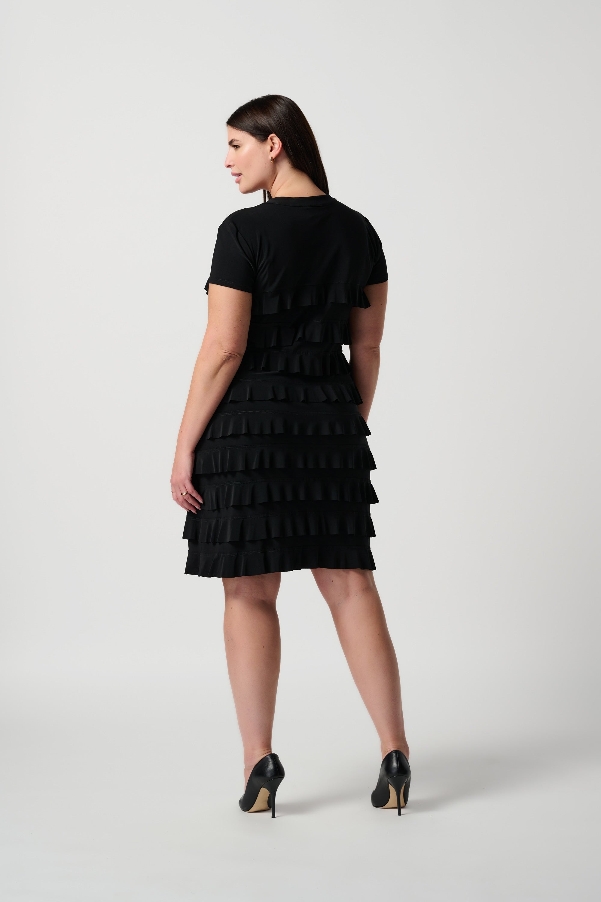 Back view of Joseph Ribkoff (211350NOS) Women's Short Sleeve Knee Length Dress With Stand Collar and Ruffle Detailing in Black