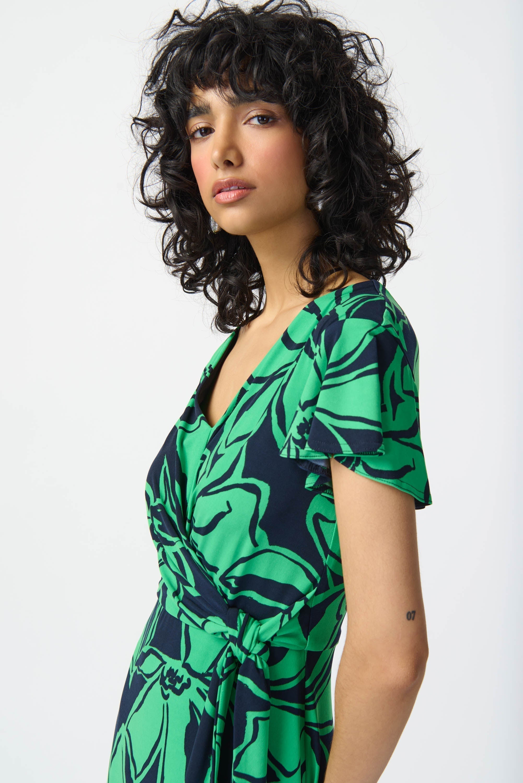 Front close up of Joseph Ribkoff (241052) Women's Short Sleeve Green Floral Midi Wrap Dress with Side Tie