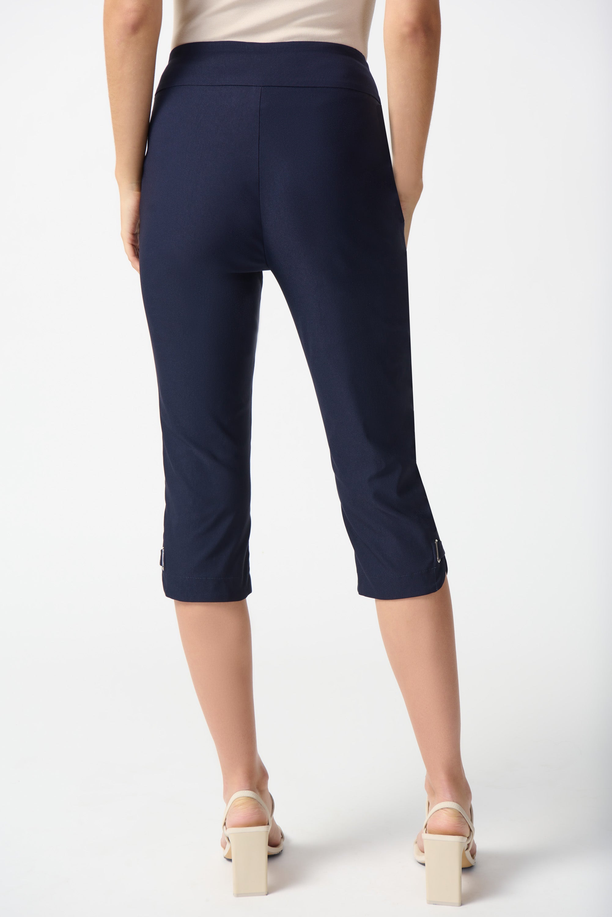 Back view of Joseph Ribkoff (242051) Women's Slim Fit Millenium Capris with  Clasp detail on hem in Midnight Navy Blue