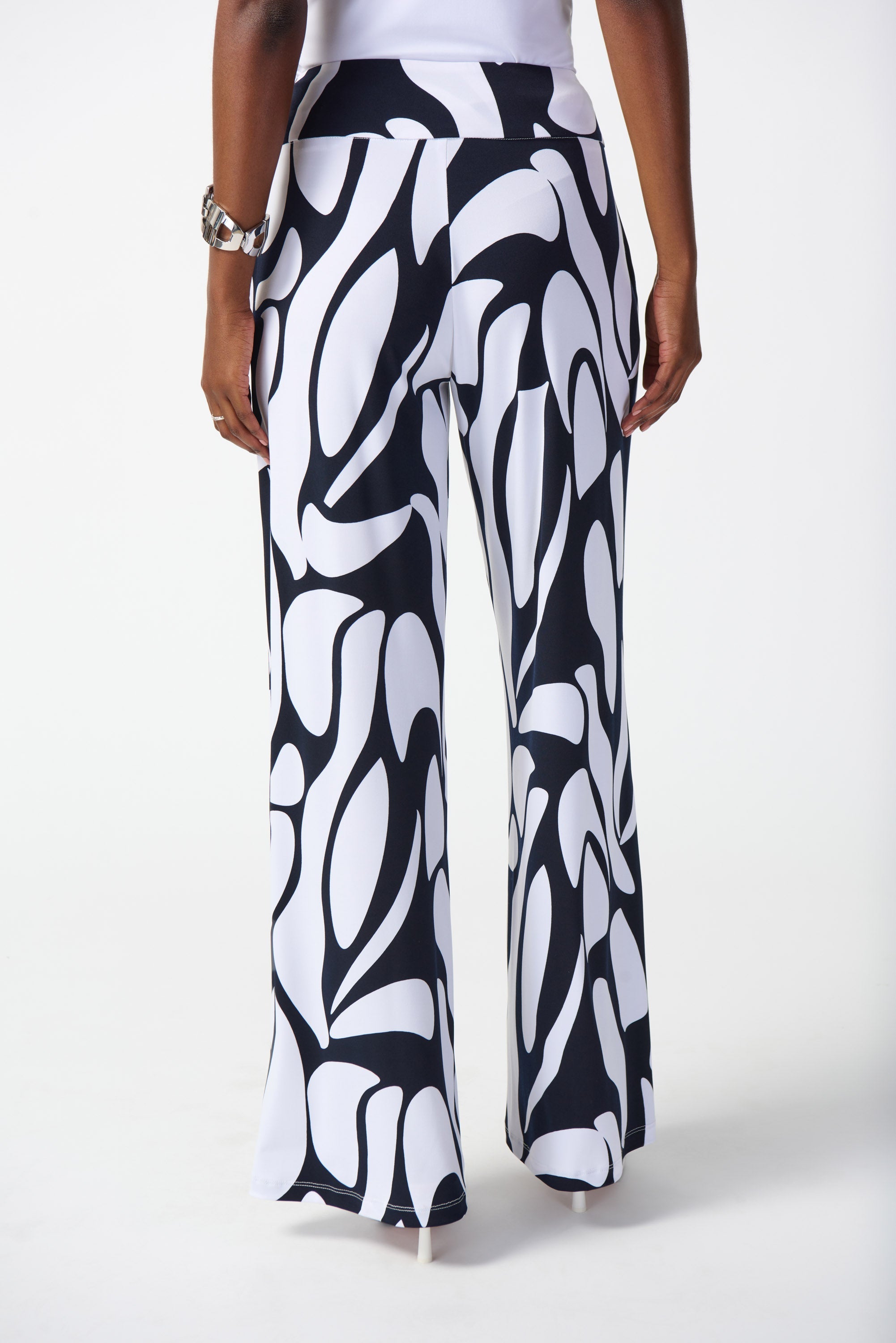 Back view of Joseph Ribkoff (242103) Women's Silky Knit Wide Leg Pants with Pockets in a Navy & White Geometric Print