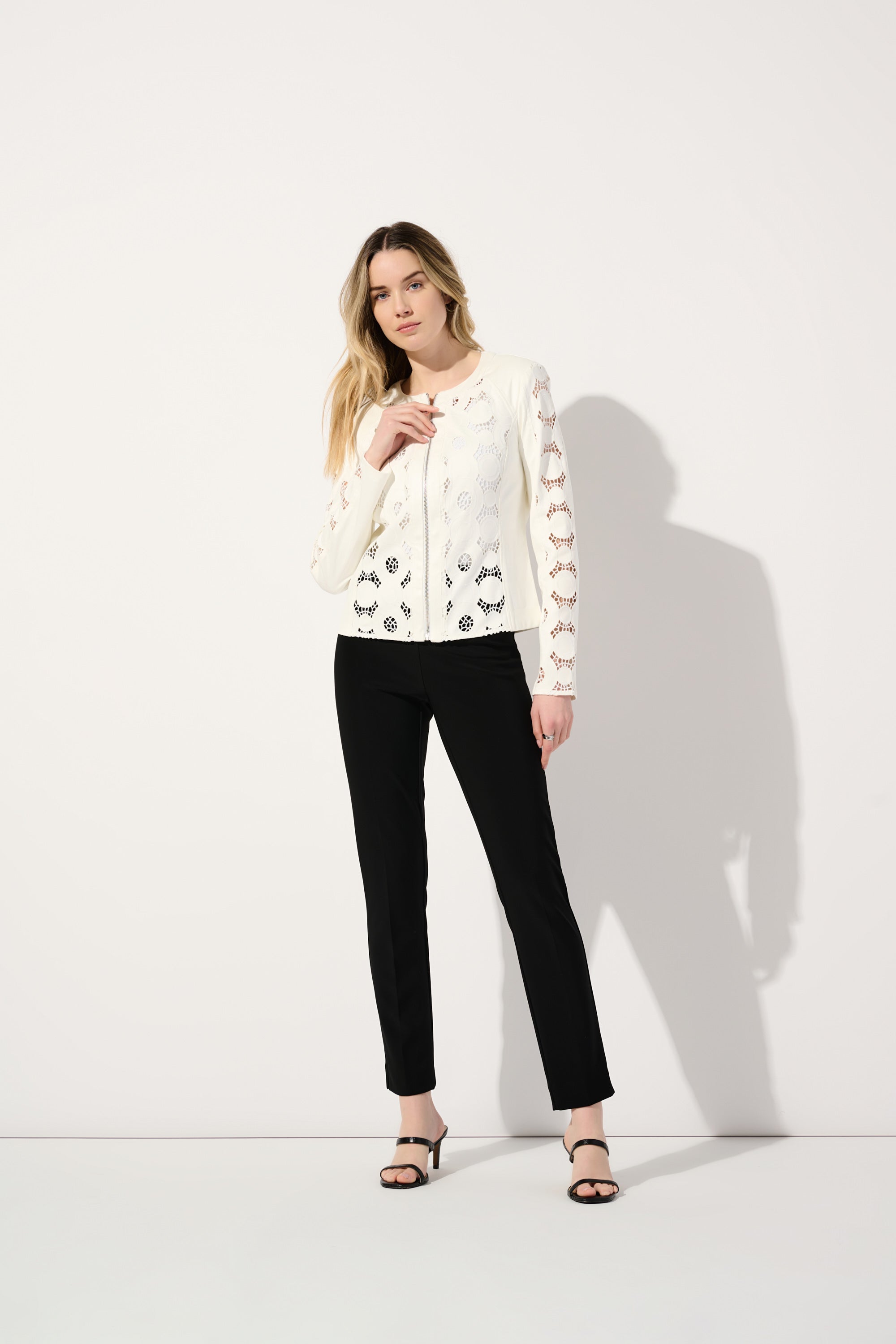 Front view of Joseph Ribkoff (242907) Women's Long Sleeve Faux Suede Jacket with Laser Cut detail in White