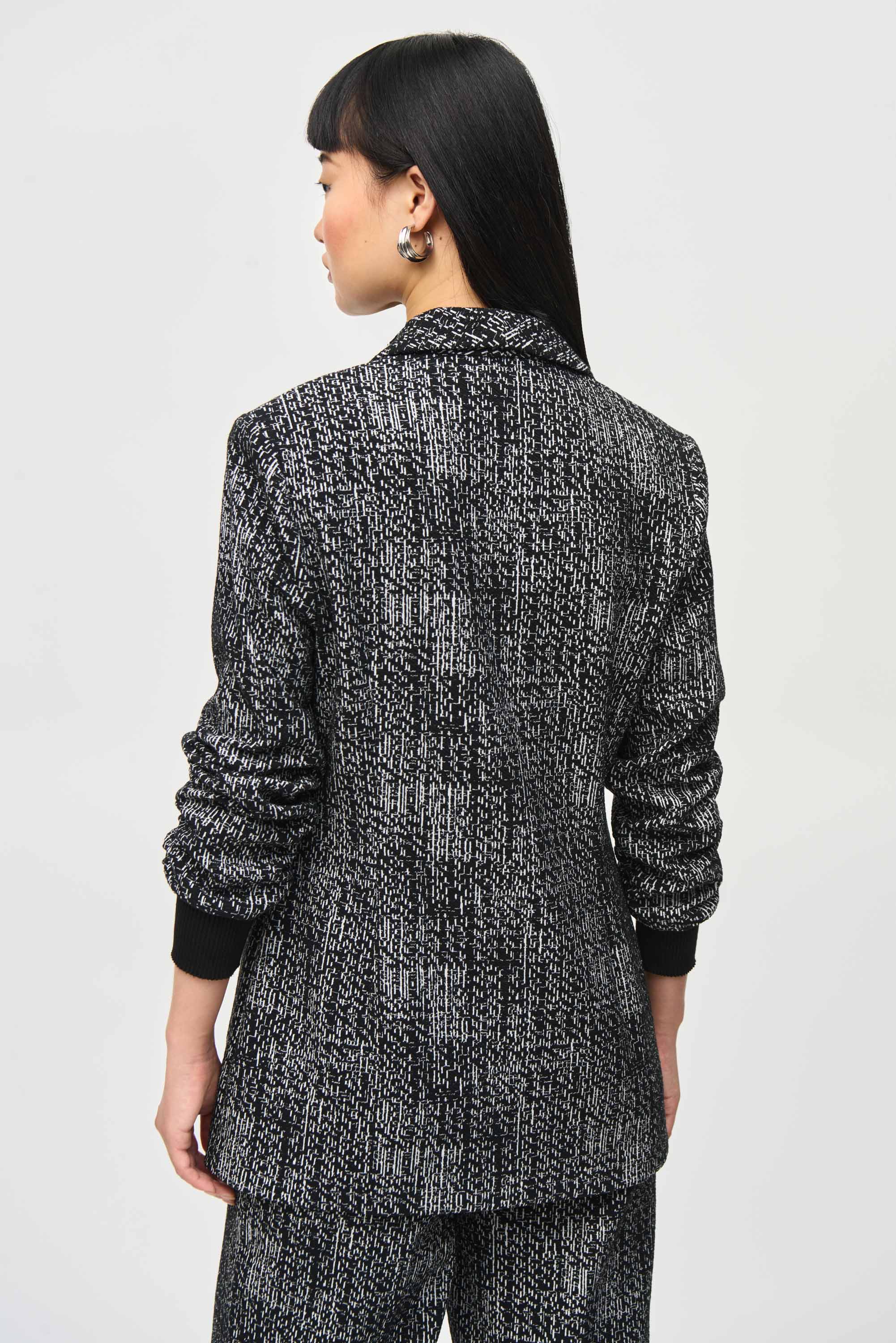 Back view of Joseph Ribkoff (243053) Women's 3/4 Ruched Sleeve Tweed Blazer, with Single Button Close and Two Front Patch Pockets in Black & White Tweed