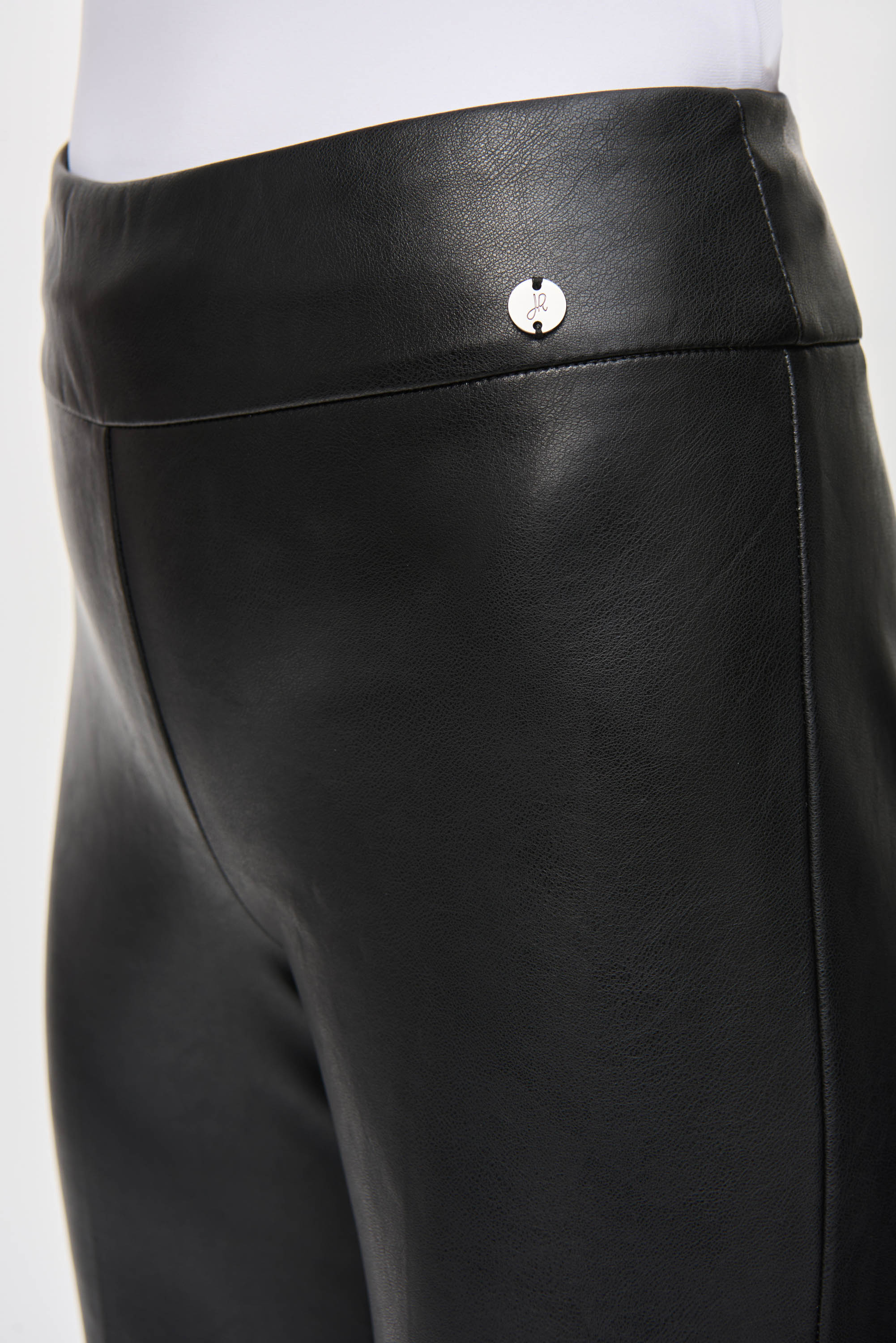 Side close up of JR charm on hip on Joseph Ribkoff (243260) Women's Black Faux Leather Cropped & Flared Pull-On Pants