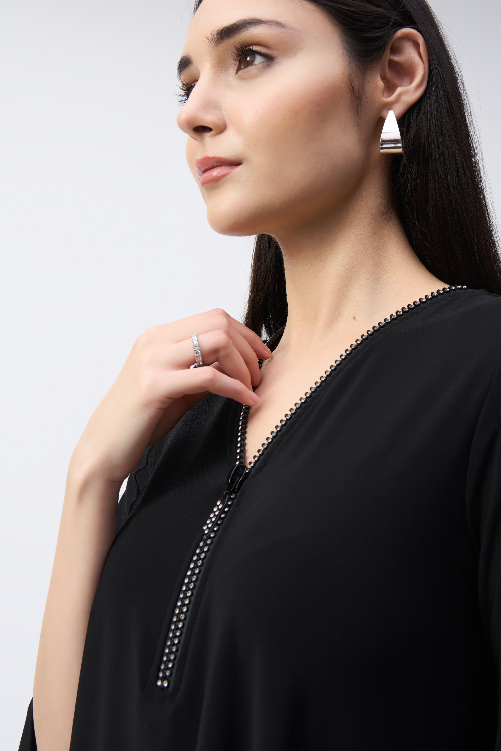 Close up of jeweled neckline on Joseph Ribkoff (243314) Women's 3/4Sleeve Rhinestone Zipper V-neck Top in Black