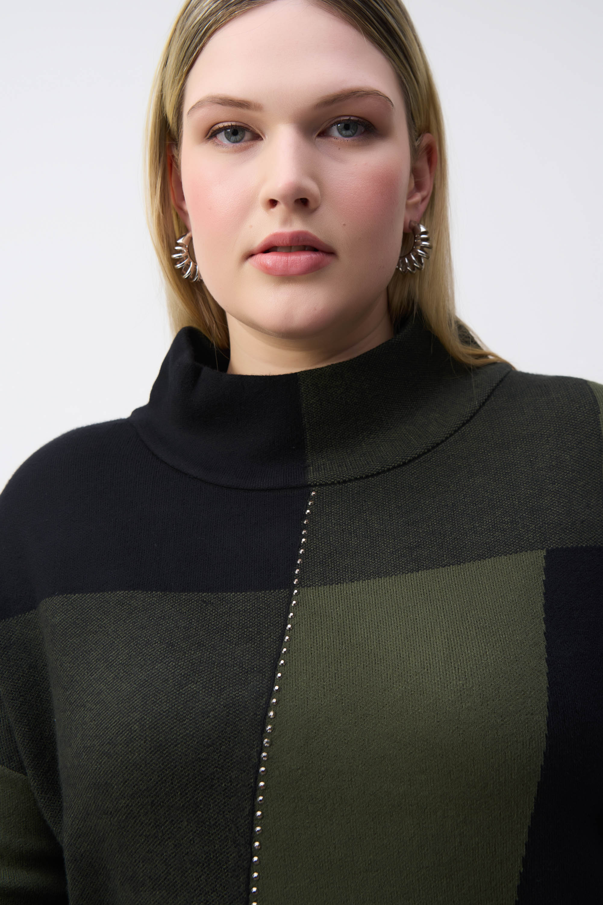 Close up of neckline on Joseph Ribkoff (243944) Women's Long Sleeve Colour-Block Jacquard Knit Pullover With Mock Neck, and Studded detailing in Black and Iguana Green