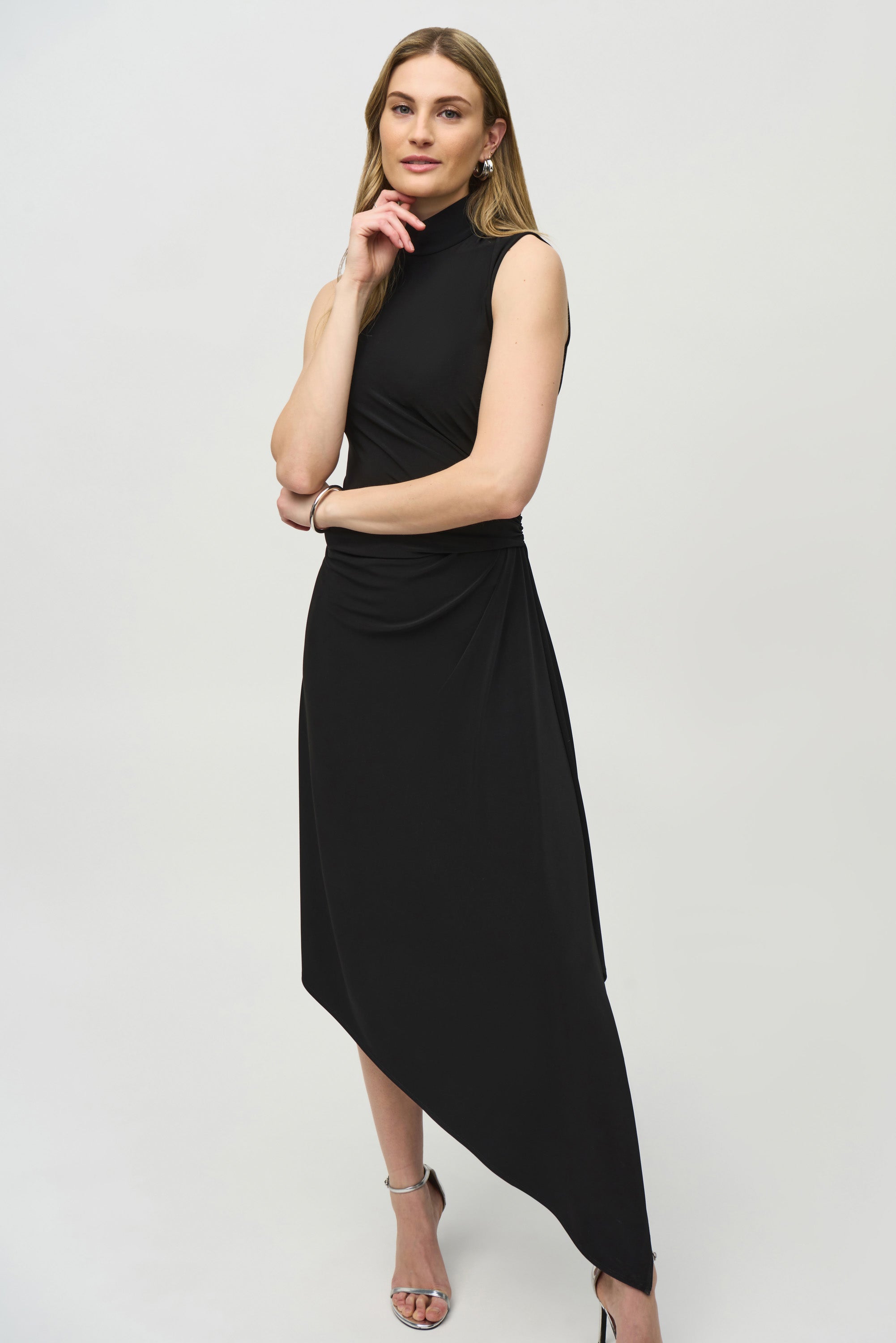 Joseph Ribkoff (244038) Sleeveless Silky Knit Fit and Flare Dress with Turtleneck and asymmetrical hemline in Black