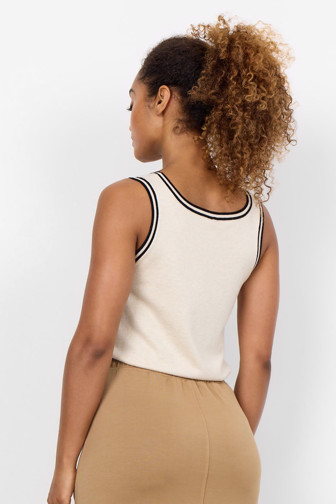 Back view of Soya Concept (33526) Women's Sleeveless Knit Tank Top in Beige with Black Contrast Trim along the Scoop Neck and armholes