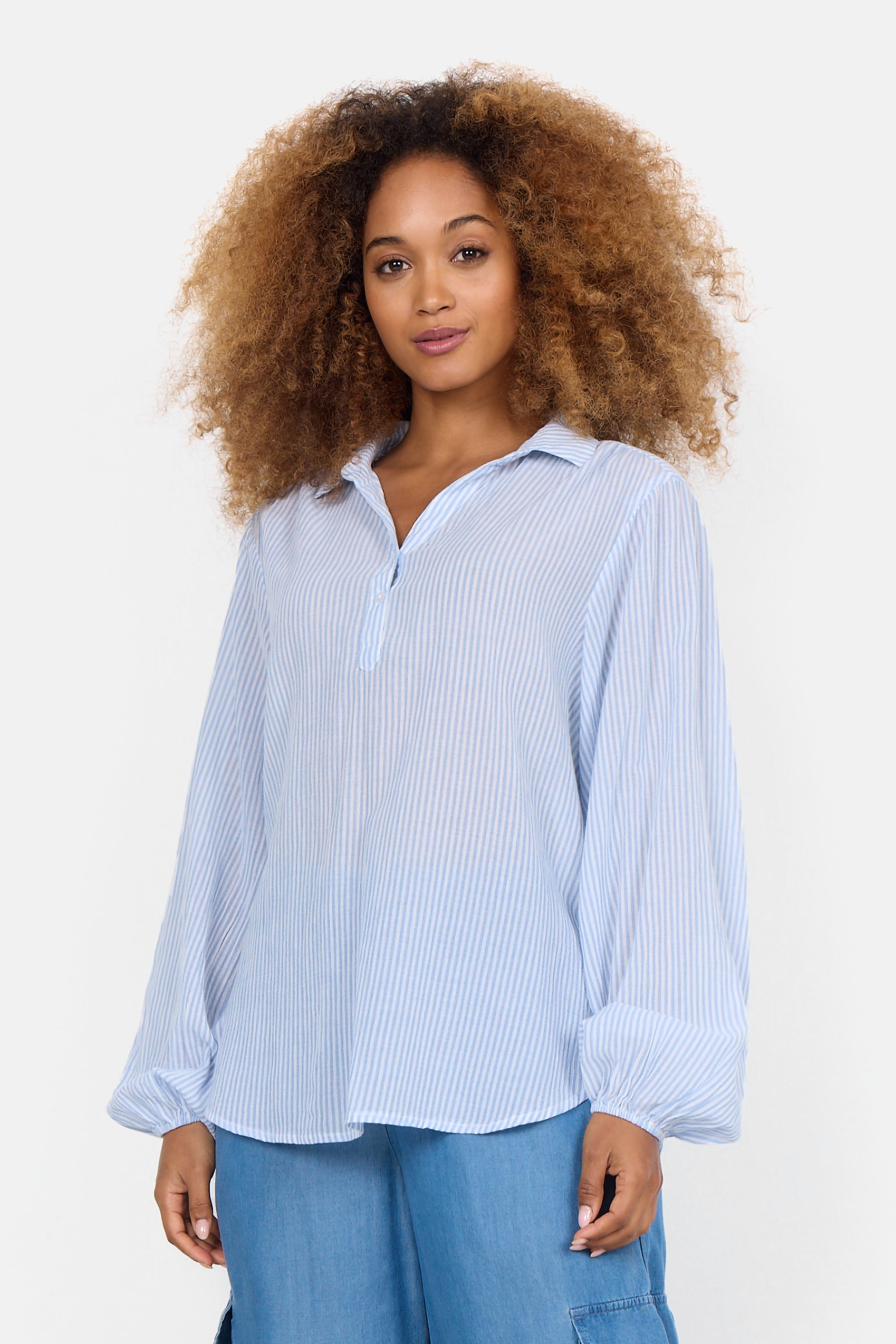 Front view of Soya Concept (40523) Women's Long Puff Sleeve Split V Shirt in Light Blue & White Vertical Stripe Print