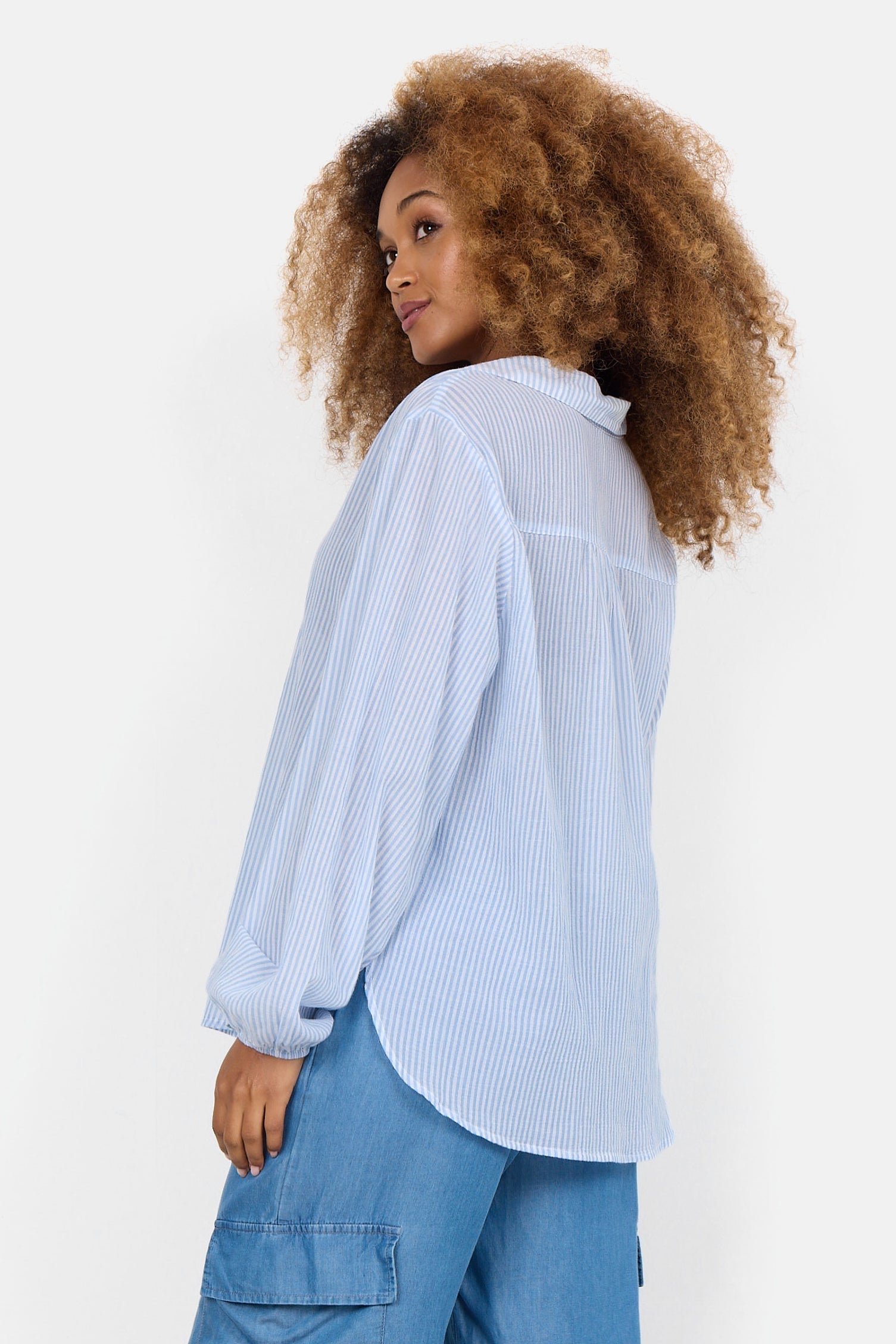Back view of Soya Concept (40523) Women's Long Puff Sleeve Split V Shirt in Light Blue & White Vertical Stripe Print