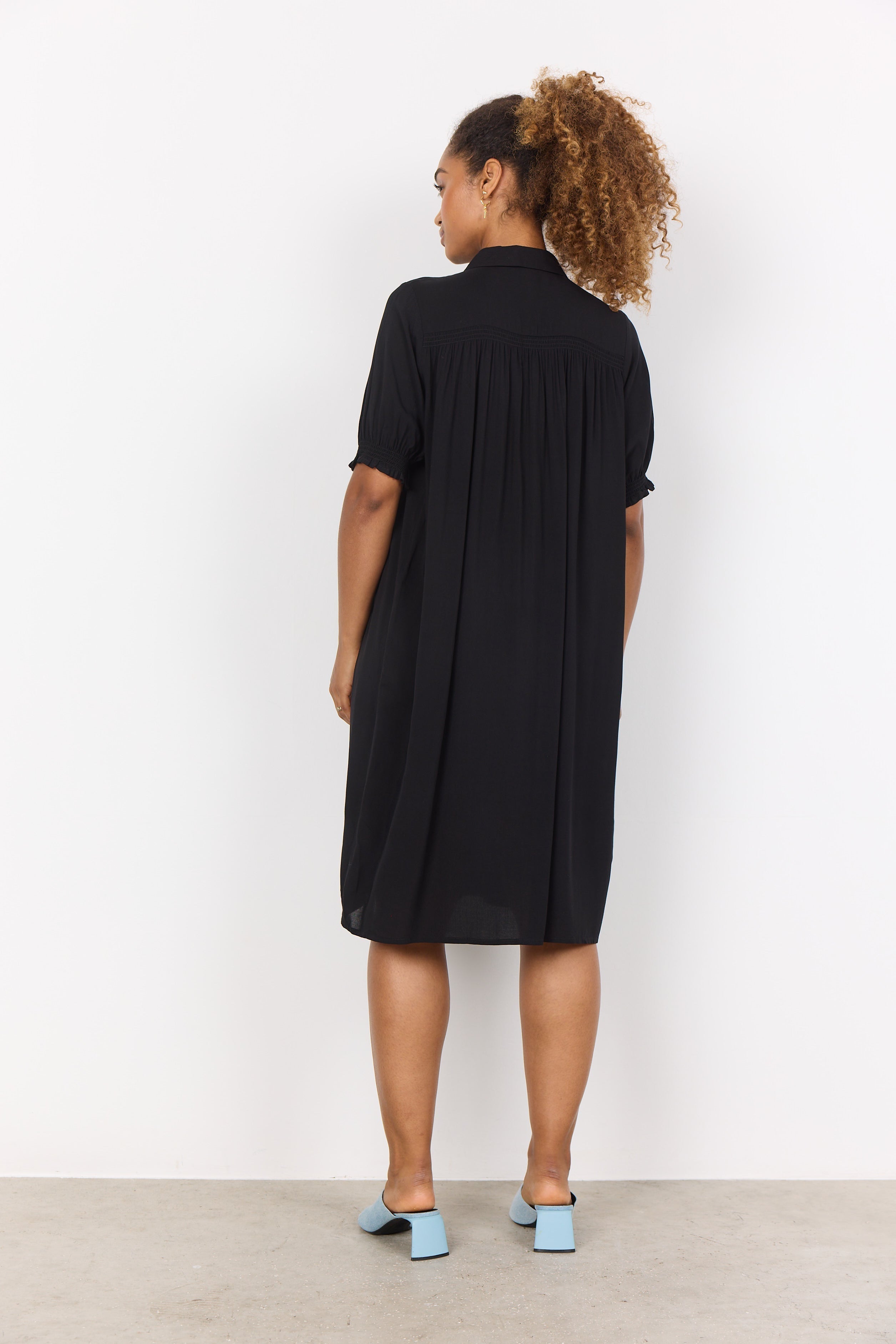 Back view of Soya Concept (40774) Women's Short Sleeve Knee Length Dress with Shirt Collar, Button Front, and A Straight, Relaxed Fit in Black