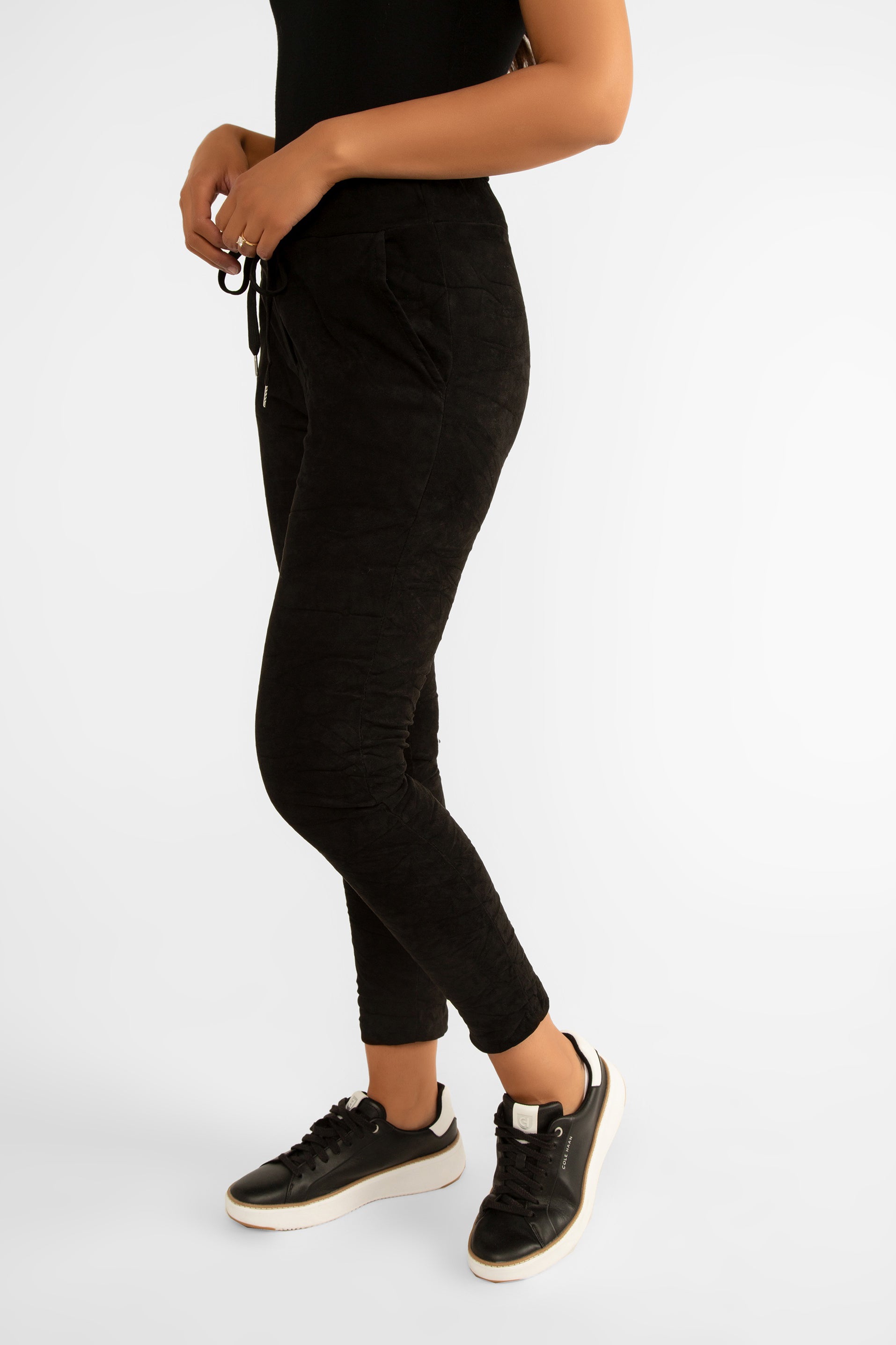 Side view of Elissia (NF93630) Women's Slim Fit Cropped Crinkle Joggers with Drawstring Waist and Pockets in Black