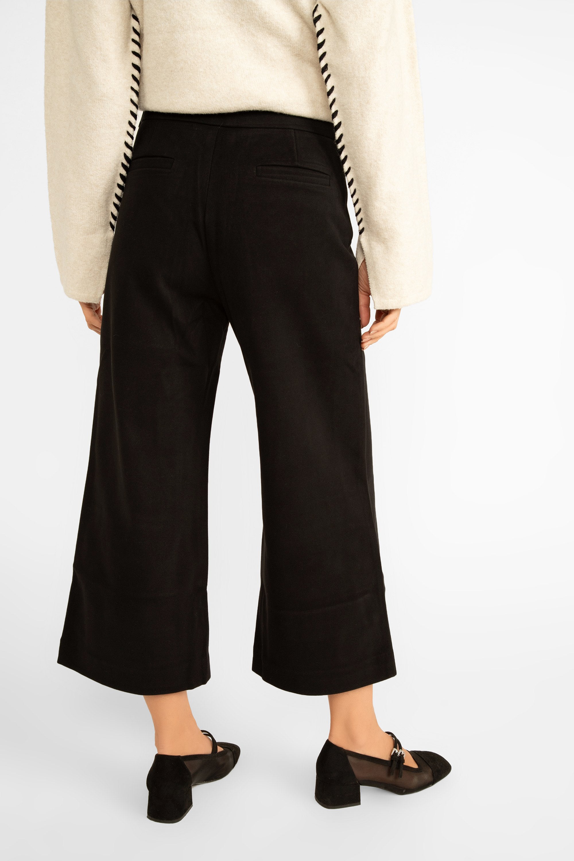 Back view of Pink Martini (PA-41198F24) Nadia Pants - Women's Wide Leg Cropped Pants with Suede link texture in Black