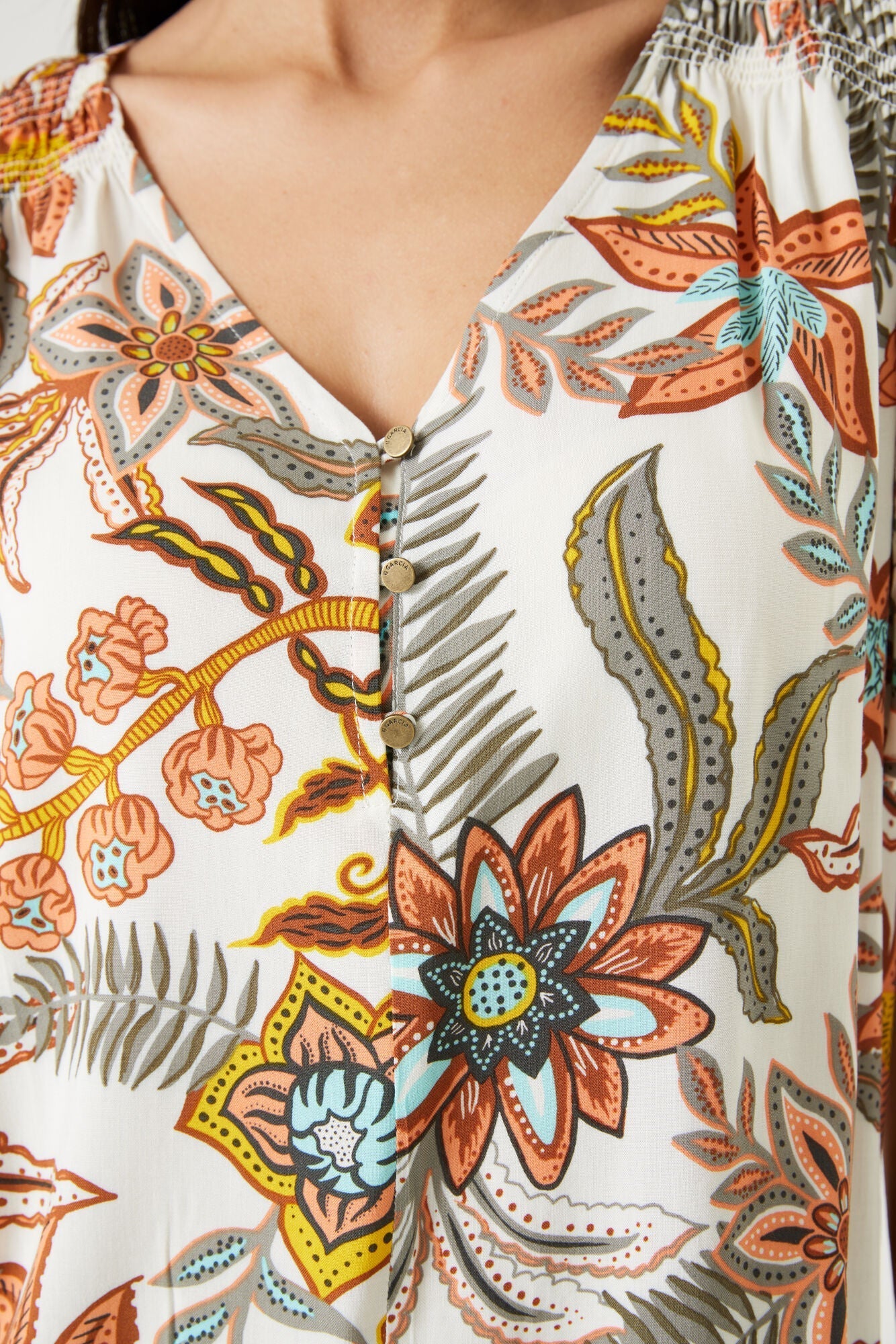 Close up of 1/4 button up on Garcia (Q40032) Women's Short Flounce Sleeve V-Neck Textured Top in Retro Orange Floral Print
