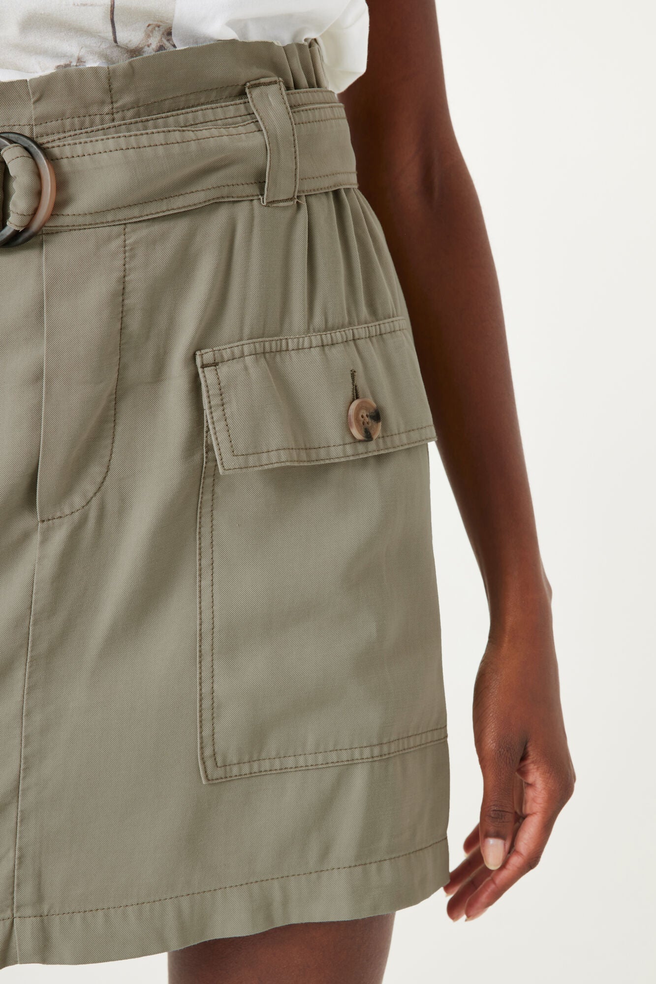 Side close up of Garcia (Q40122) Women's High Rise Paper Bag Waist Mini Skirt with Two Front Cargo Pockets in Seagrass Khaki Green