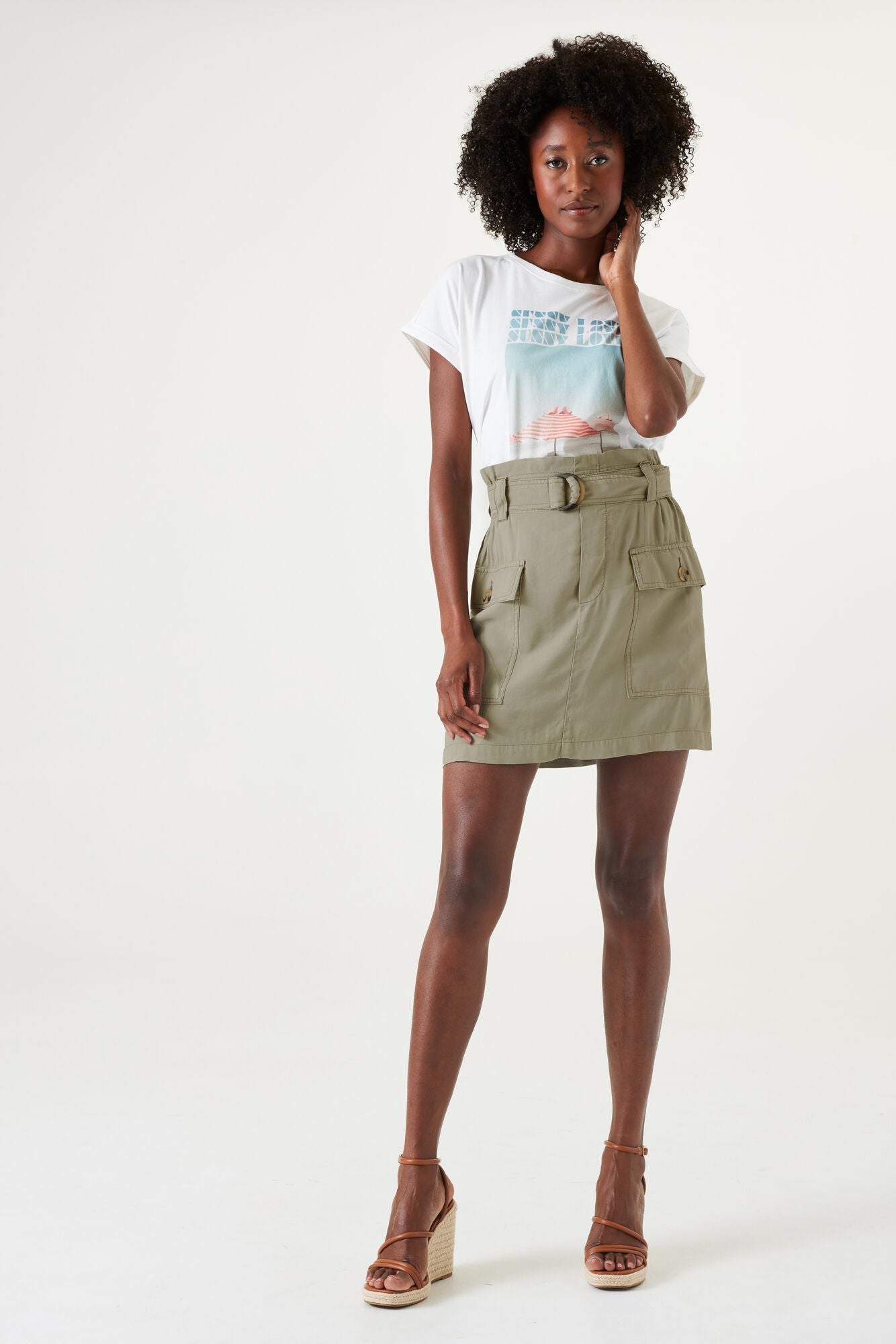 Front full body view of Garcia (Q40122) Women's High Rise Paper Bag Waist Mini Skirt with Two Front Cargo Pockets in Seagrass Khaki Green