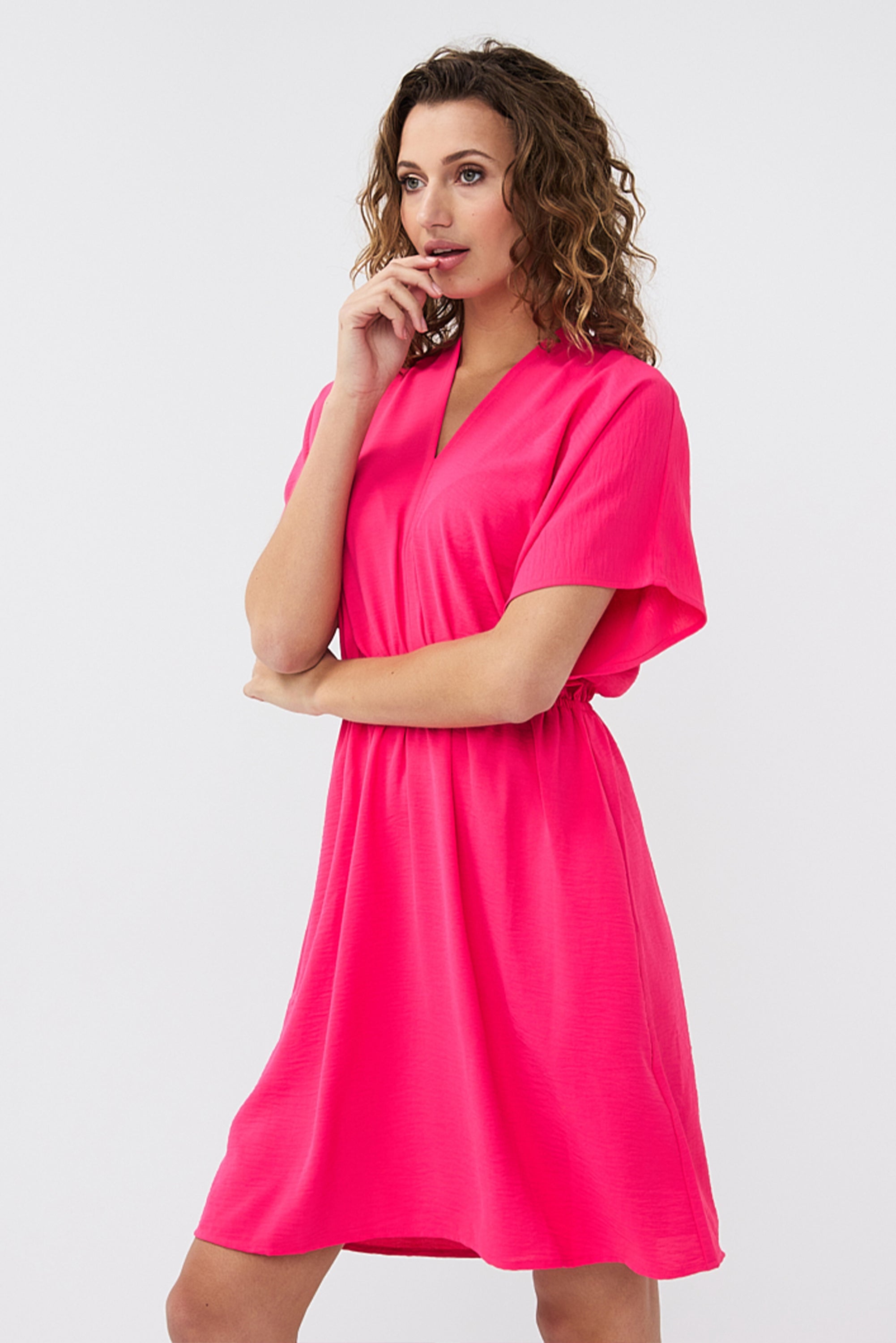 Side view of Esqualo (HS2410216) Women's Short Dolman Sleeve Mini Dress in a Magenta Pink Crinkle Textured Fabric