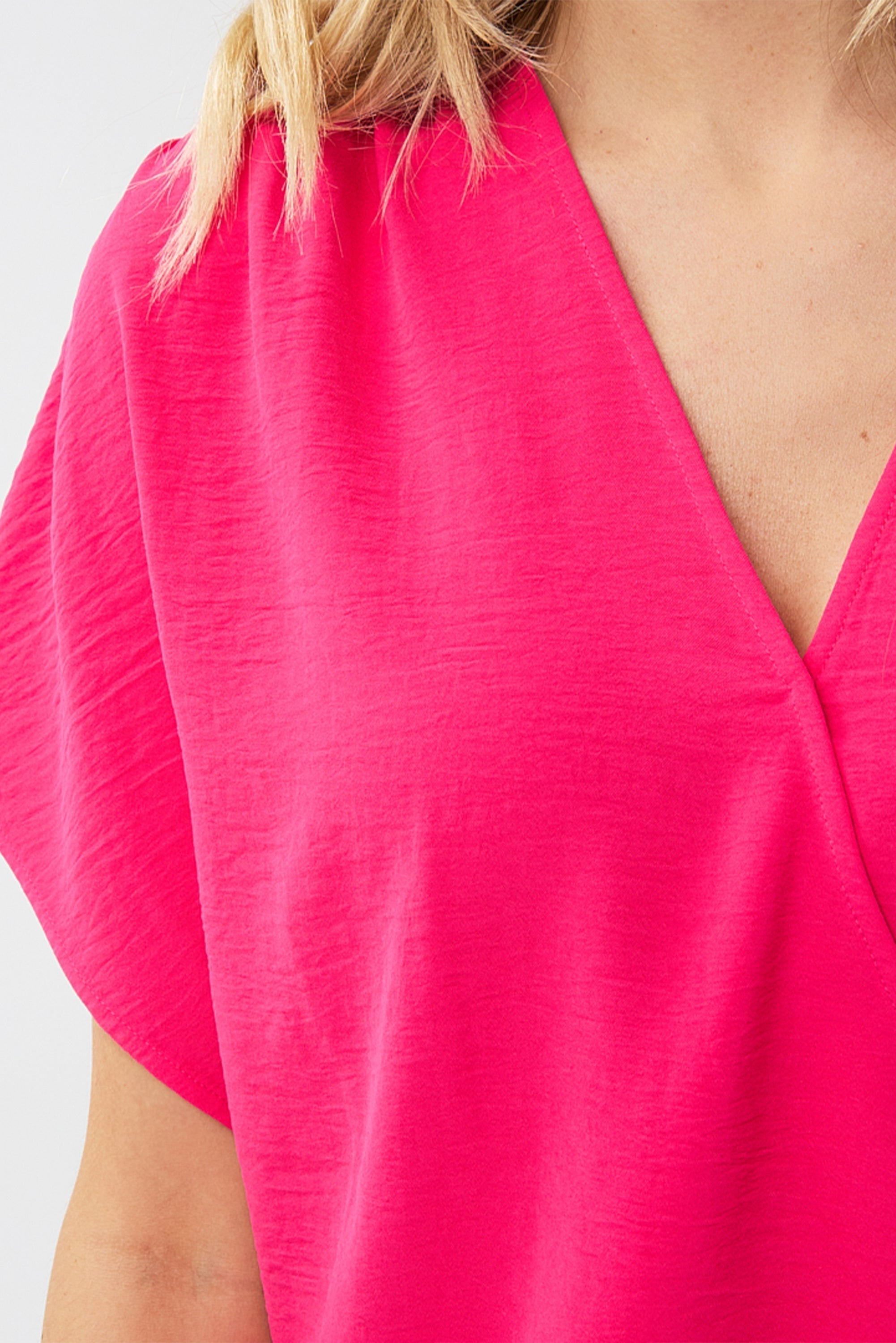 Close up front view of Esqualo (HS2410217) Women's Short Sleeve Crinkle Fabric Wrap Blouse in Magenta