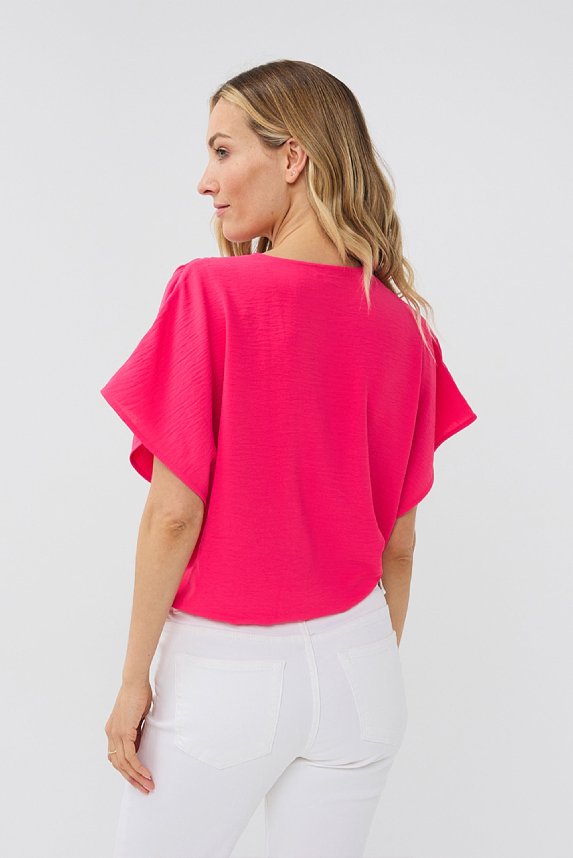 Back view of Esqualo (HS2410217) Women's Short Sleeve Crinkle Fabric Wrap Blouse in Magenta