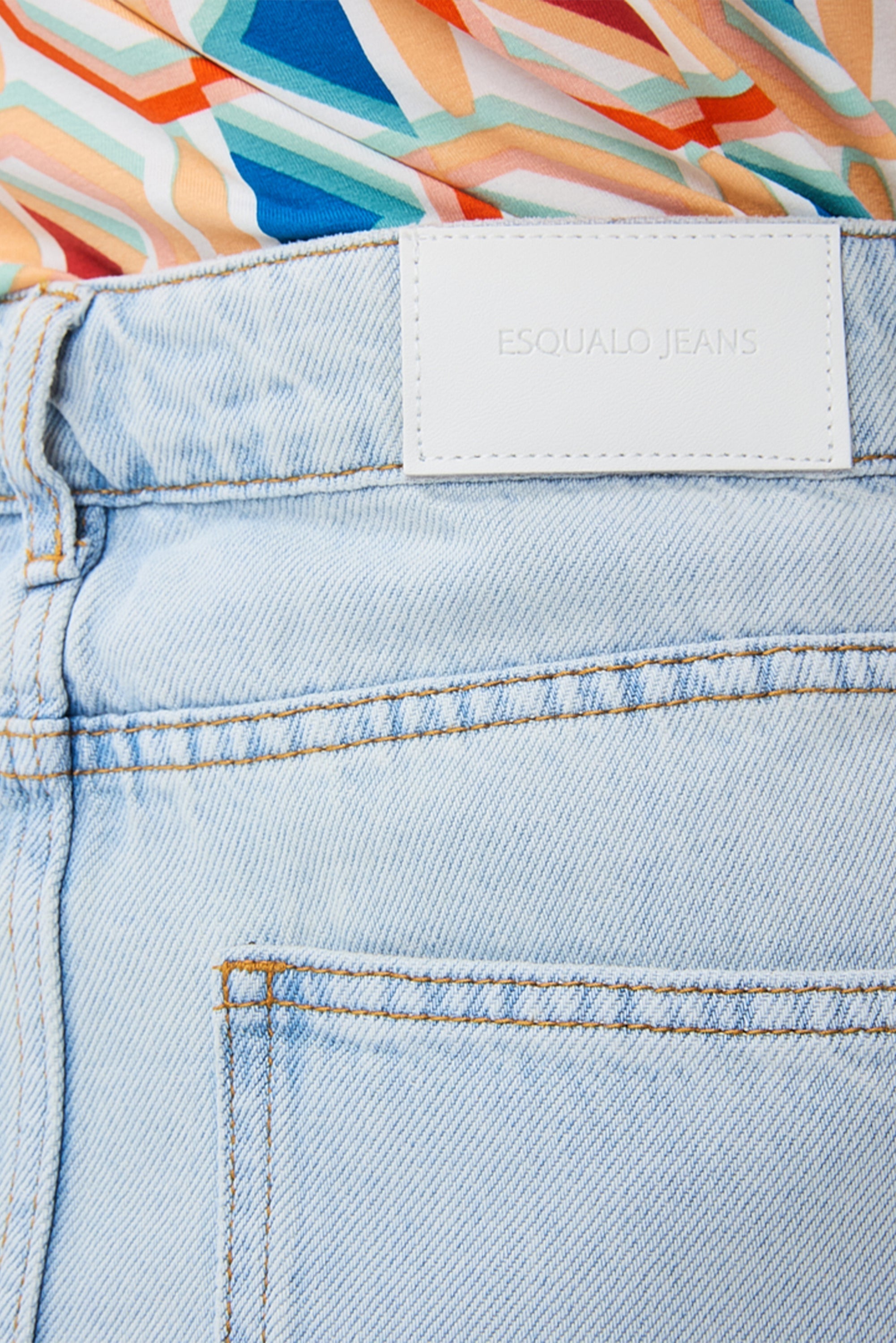 Close up of waistband and Esqualo badge on Esqualo (HS2412210 Women's 5-Pocket Denim Midi Skirt in Light Blue Wash
