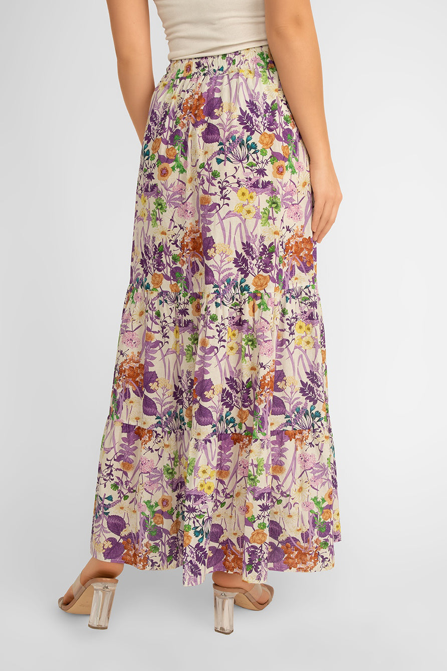 Back view of Juilietta (H2142-M32_A3320-M2) Women's Maxi  Length Tiered Skirt in a Purple and multi-coloured floral print