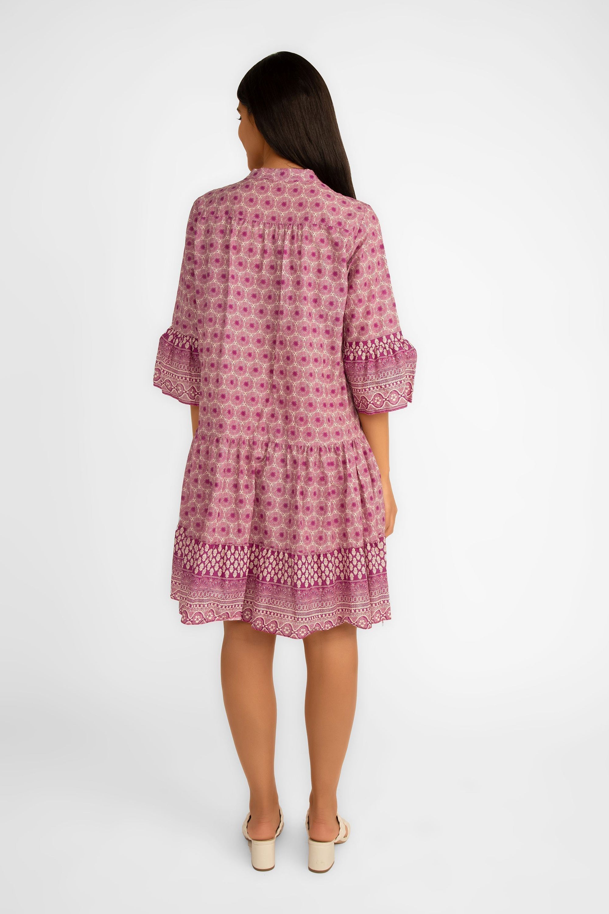 Back view of Julietta (10-H2654-M32) Women's 3/4 Tulip Sleeve Tiered Mini Dress in a Magenta and white geometric print with ornate printed trim