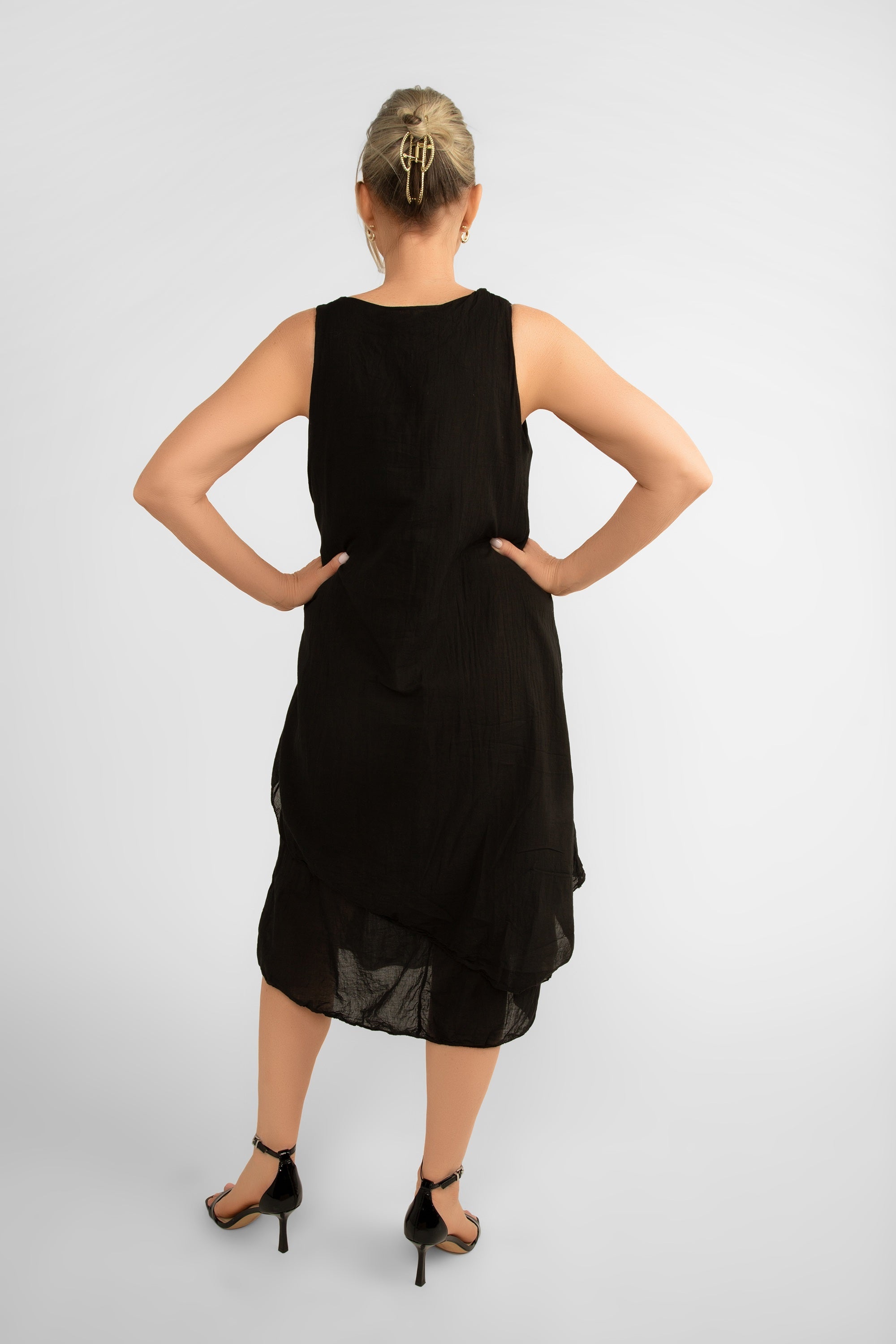 Back view of Me & Gee (12-1208) Women's Sleeveless Front Knot Midi Dress Made from layered cotton in Black