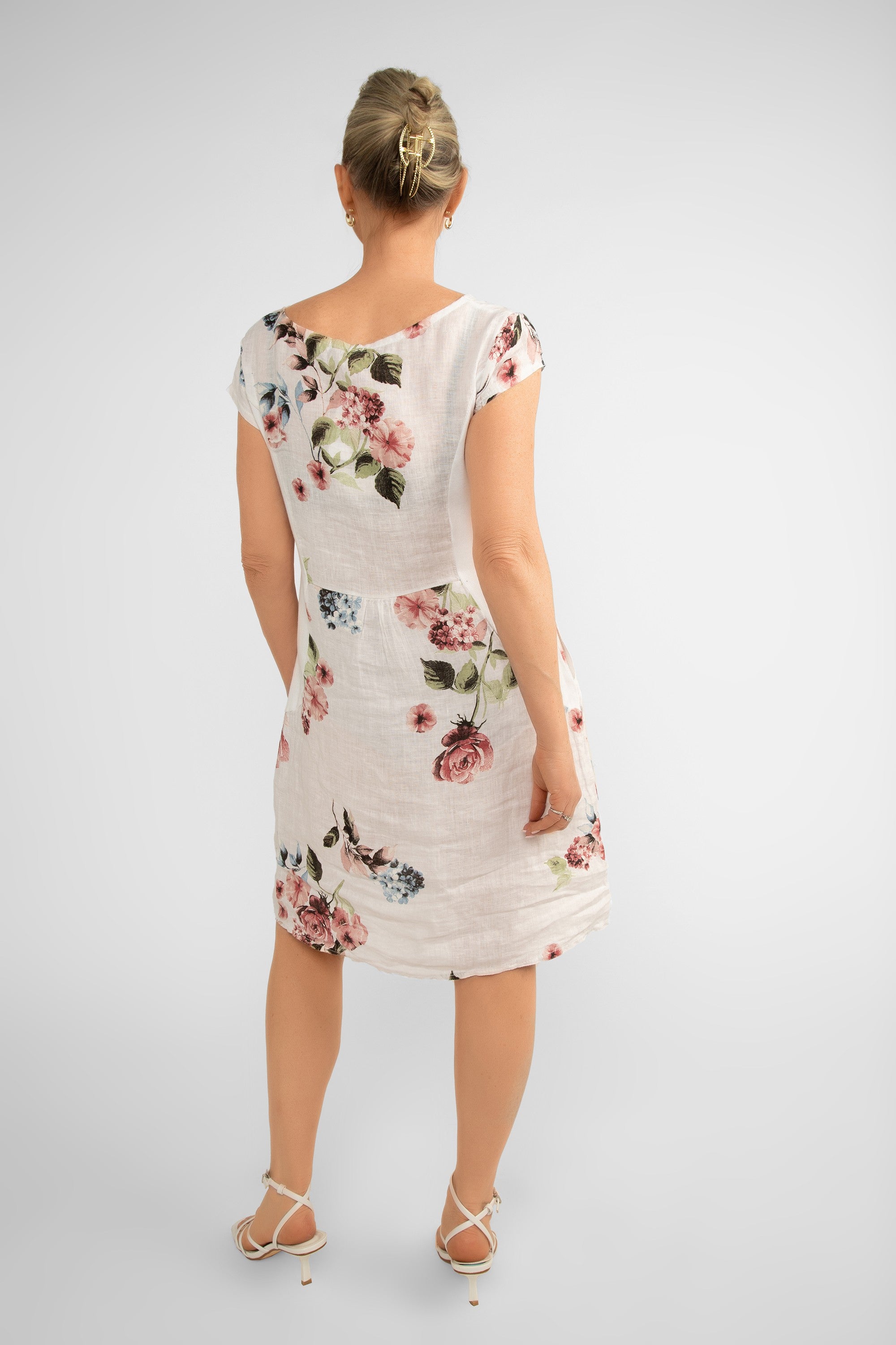 Back view of Me & Gee (19-7159-FLOWER-S24) Women's Short Cap Sleeve Rose Print Linen Knee Length Dress with Pockets in White