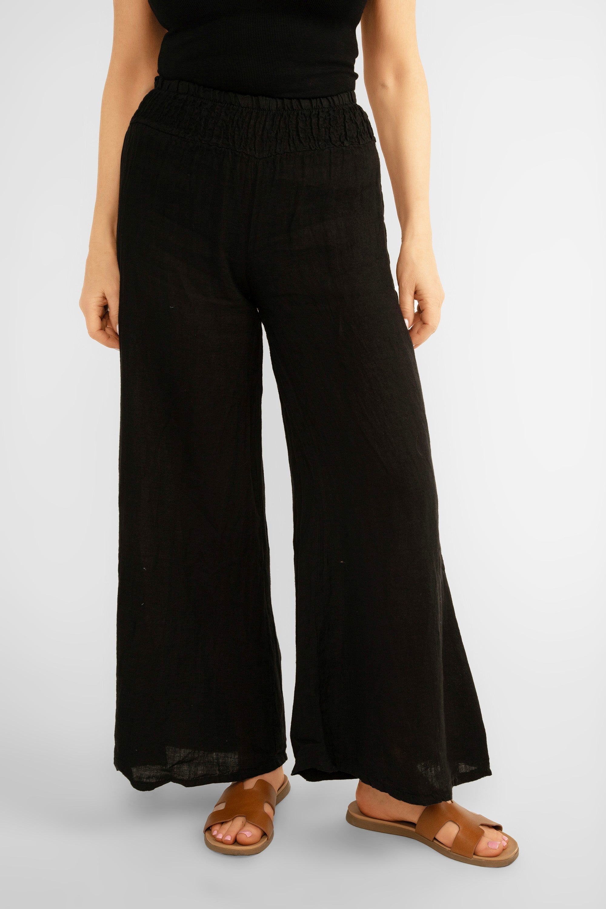 Front view of Me & Gee (19-801-S24) Women's Wide Leg Smocked Waist Linen Pants in Black