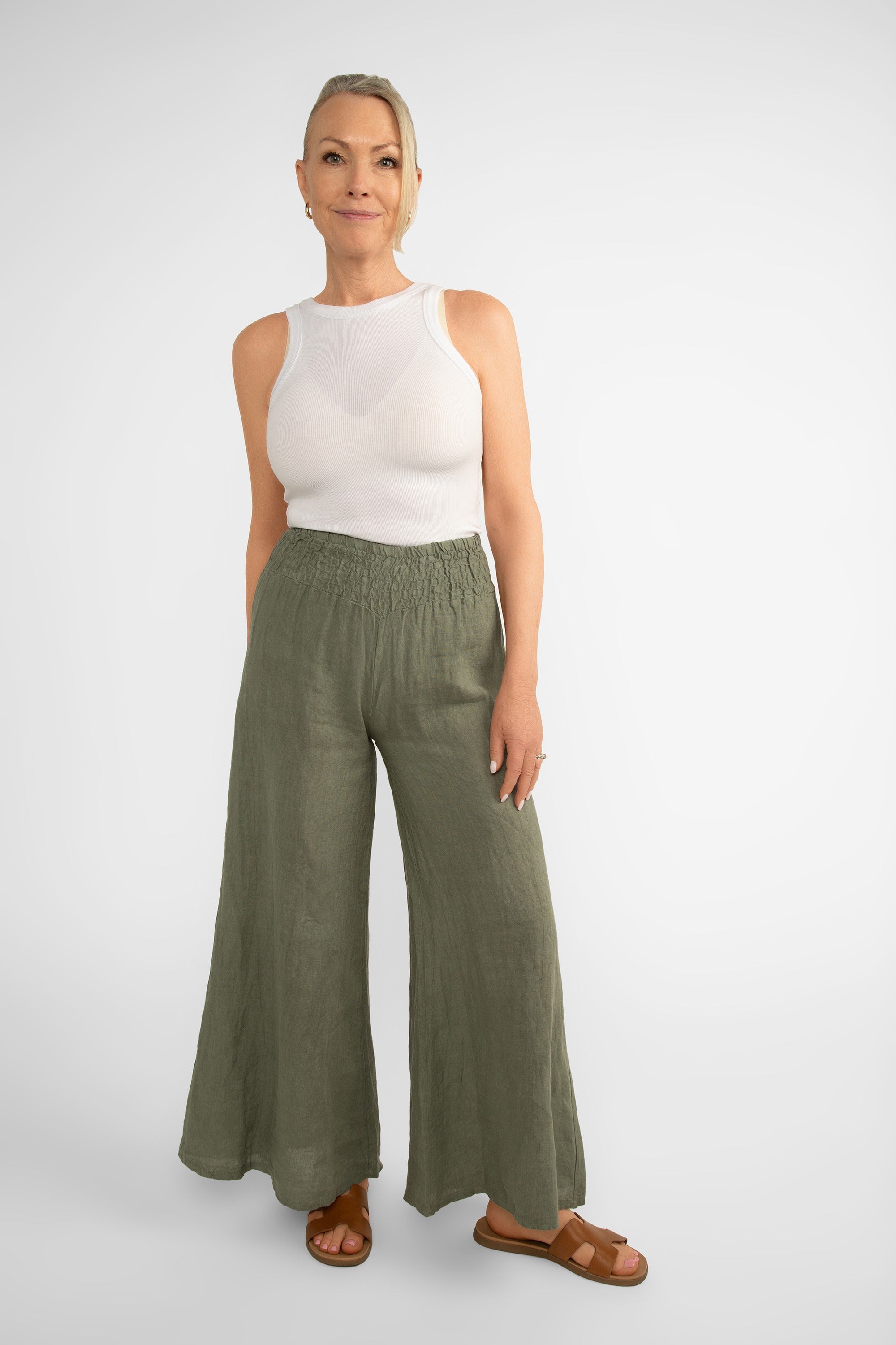 Front view of Me & Gee (19-801-S24) Women's Wide Leg Smocked Waist Linen Pants in Military Green