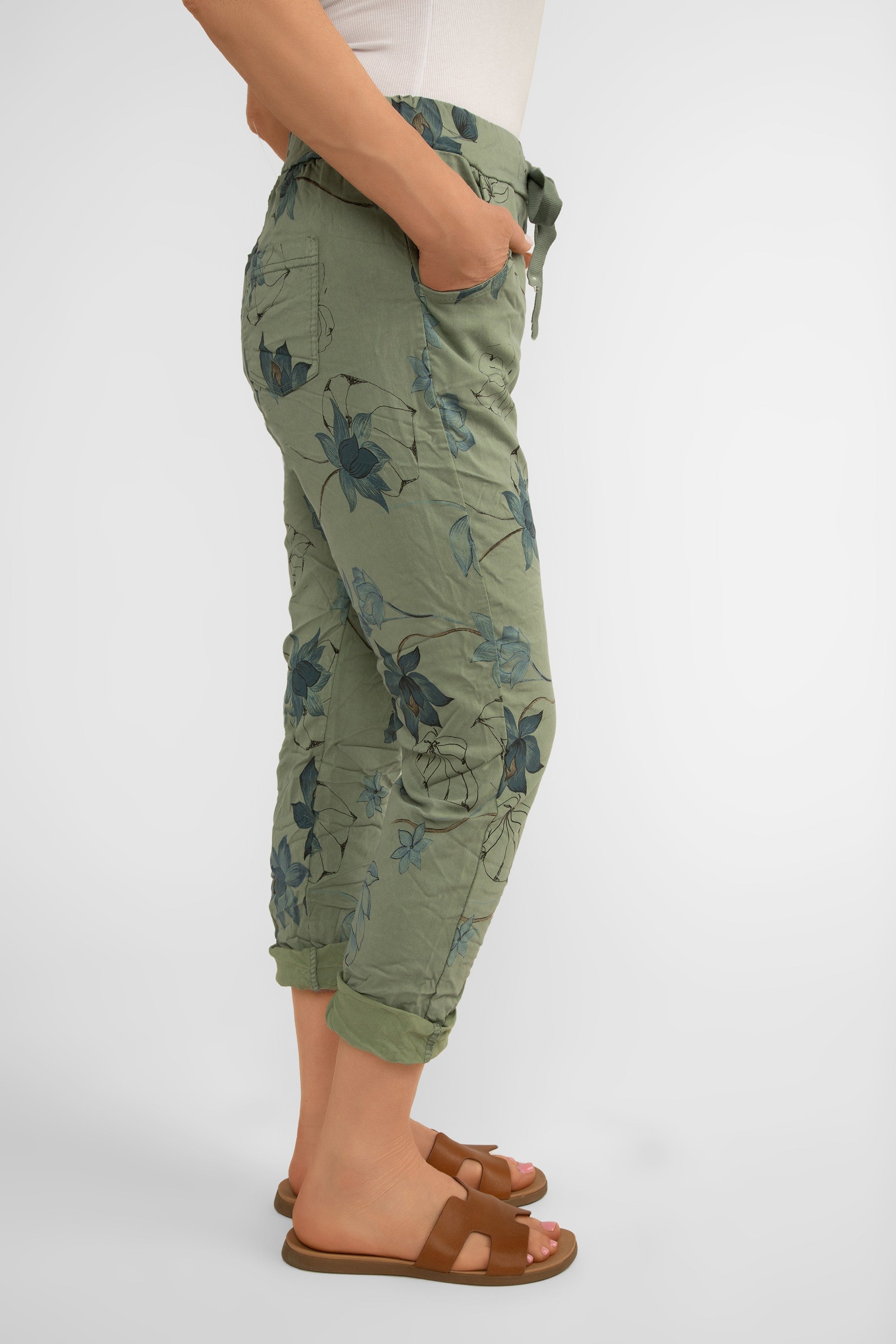 Side view of Bella Amore (21036) Women's Pull On Crinkle Pants with Side Pockets, Rolled Hem, and Blue Lotus Flower Print in Military Green