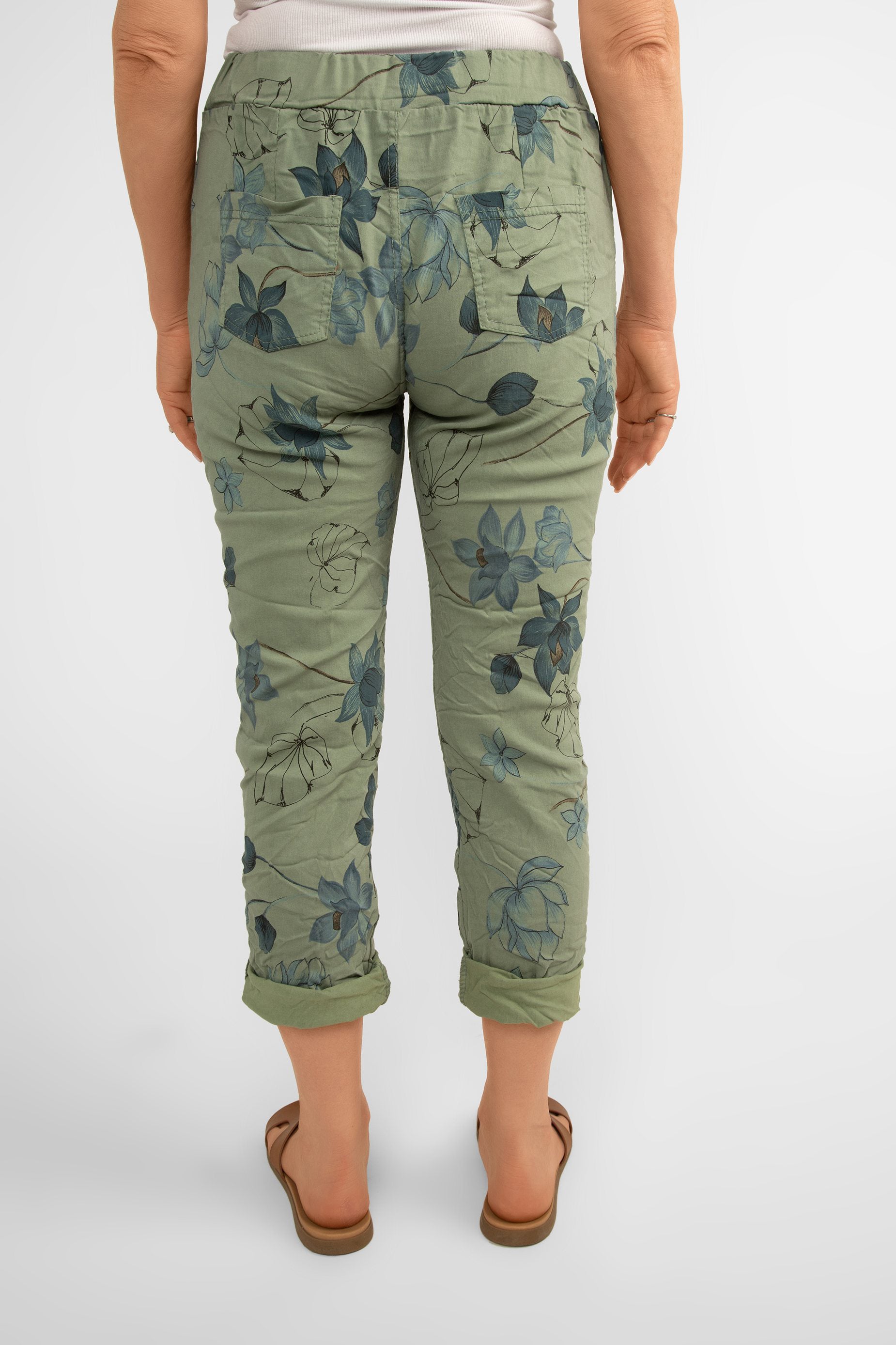 Back view of Bella Amore (21036) Women's Pull On Crinkle Pants with Side Pockets, Rolled Hem, and Blue Lotus Flower Print in Military Green
