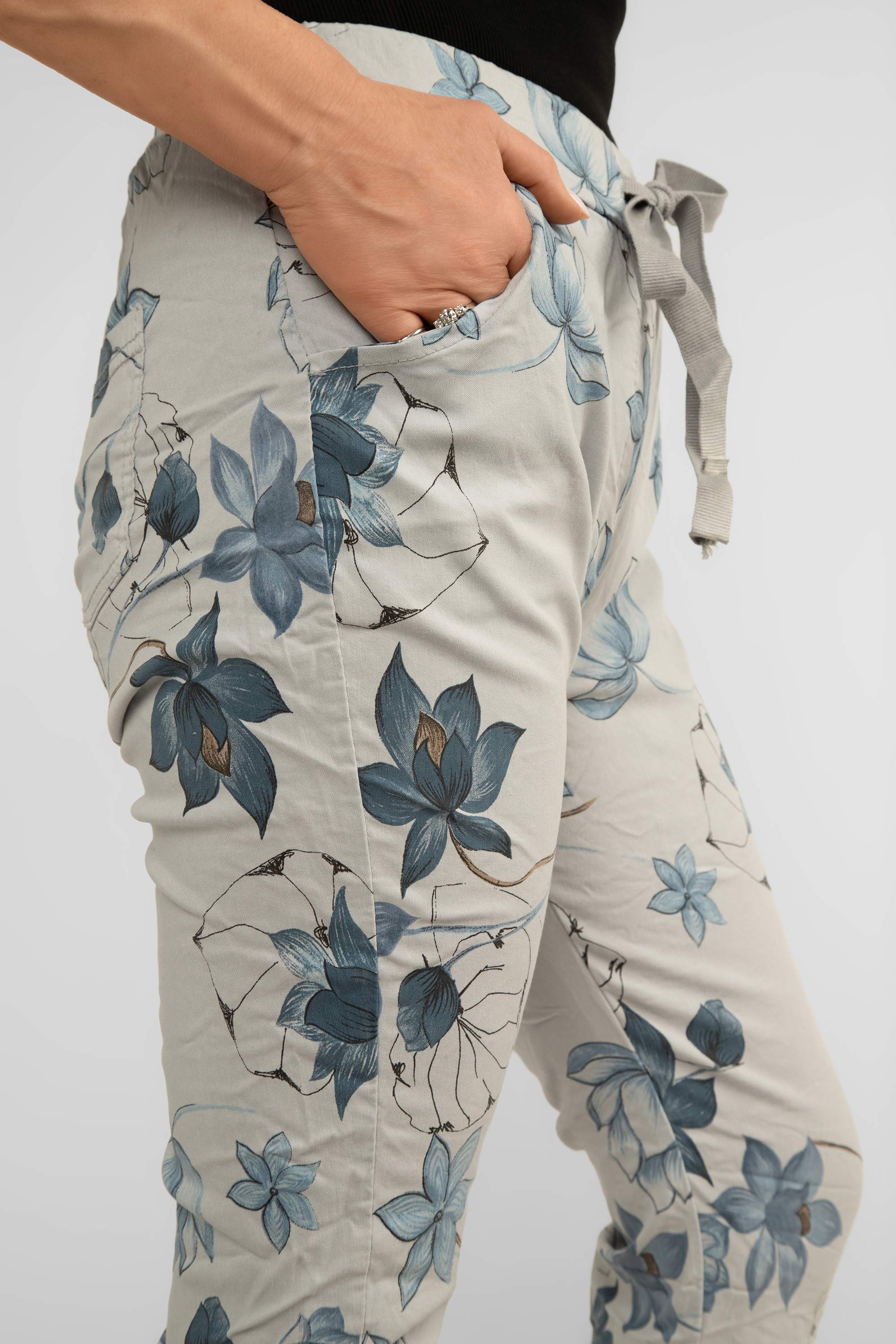 Close up side view of pocket on Bella Amore (21036) Women's Pull On Crinkle Pants with Side Pockets, Rolled Hem, and Blue Lotus Flower Print in Grey