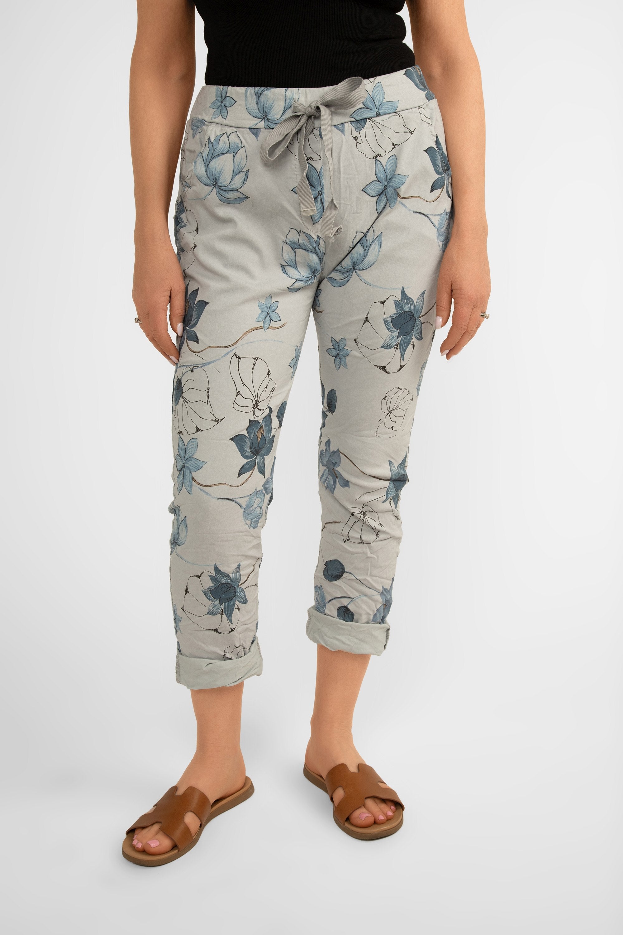 Front view of Bella Amore (21036) Women's Pull On Crinkle Pants with Side Pockets, Rolled Hem, and Blue Lotus Flower Print in Grey