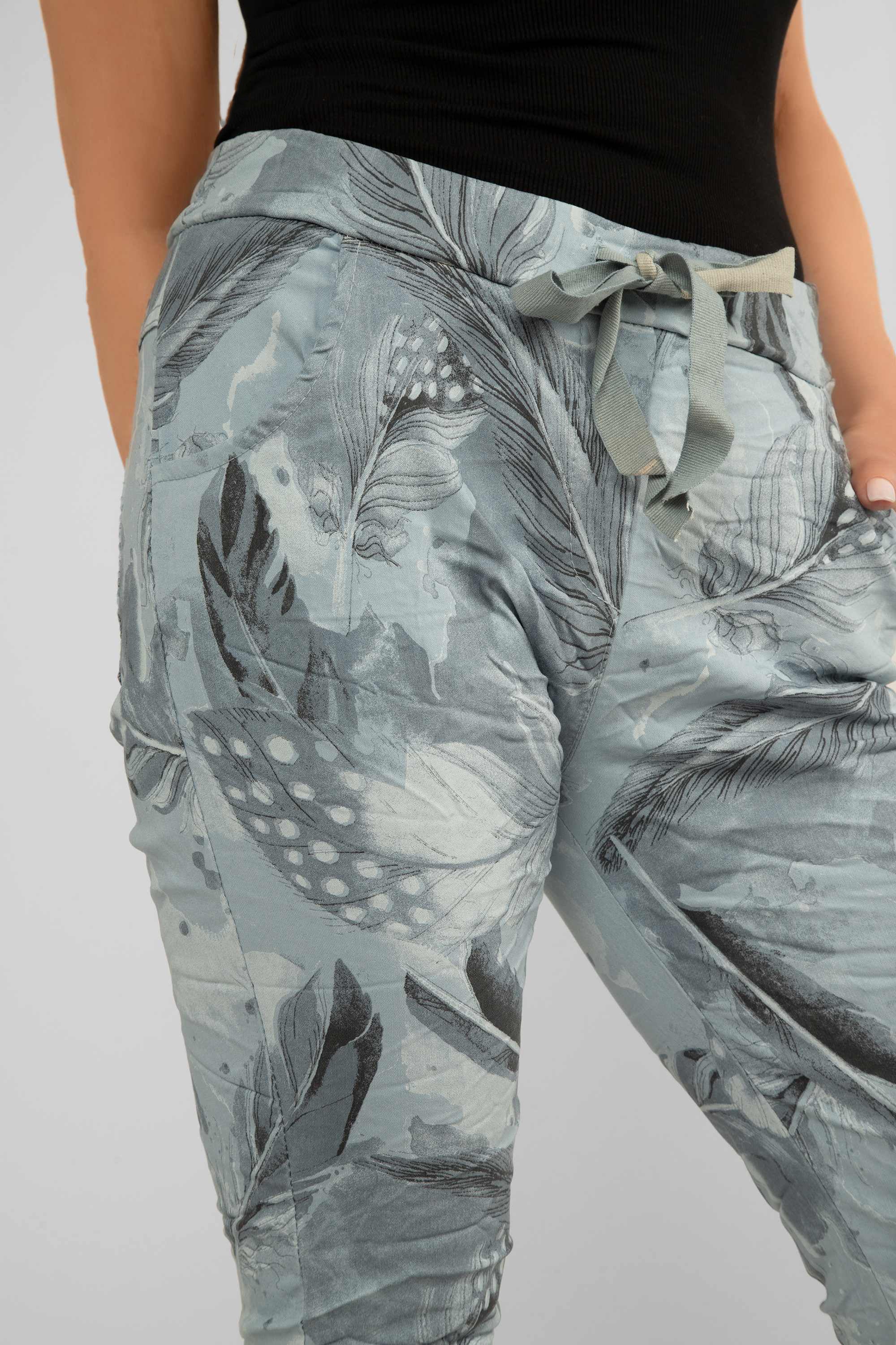Side close up of Bella Amore (21144) Women's Slim Fit Cropped Crinkle Pants with Side Pockets, Pull-on waist in Sky Blue Feather Print