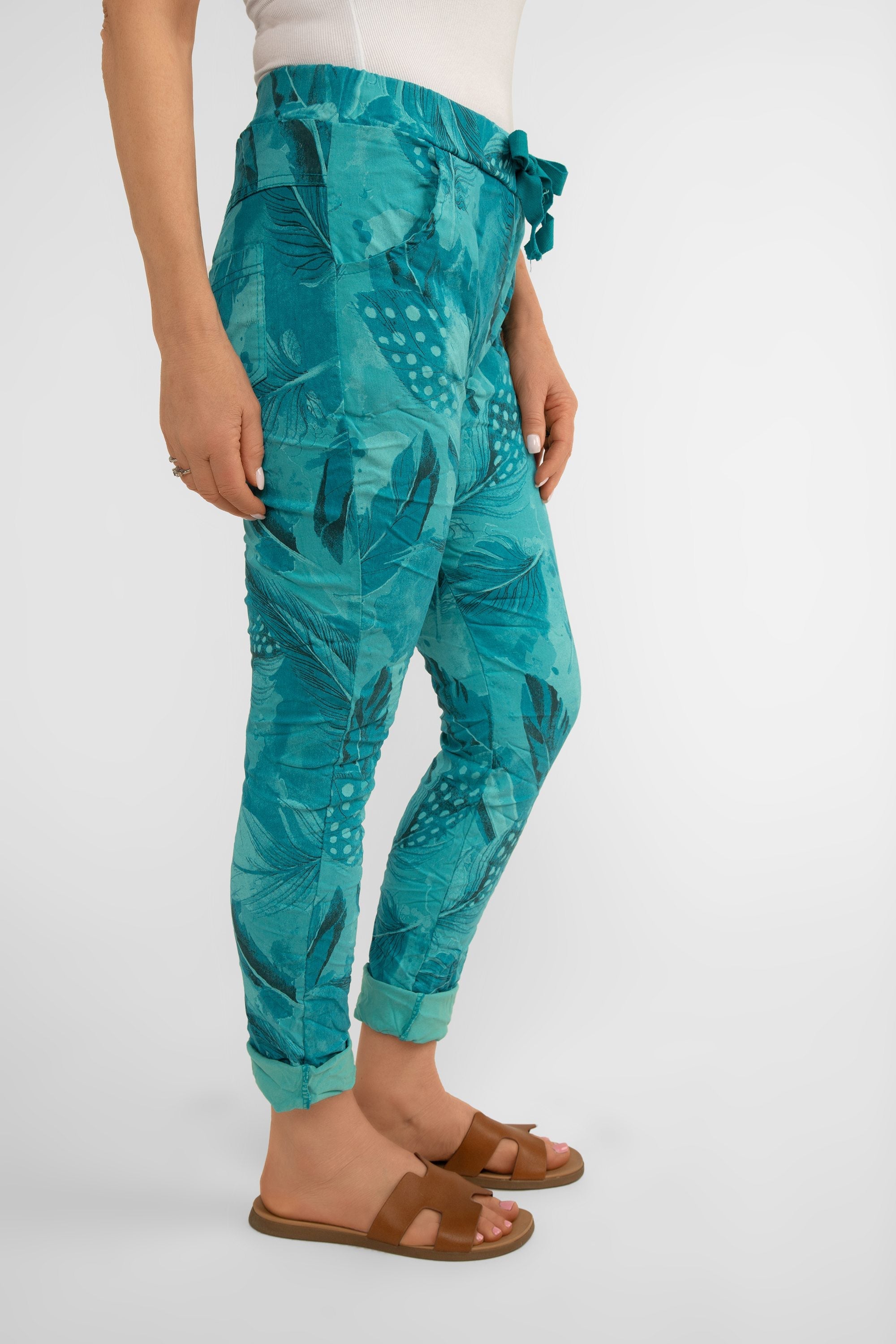 Side view of Bella Amore (21144) Women's Slim Fit Cropped Crinkle Pants with Side Pockets, Pull-on waist in Teal Feather Print