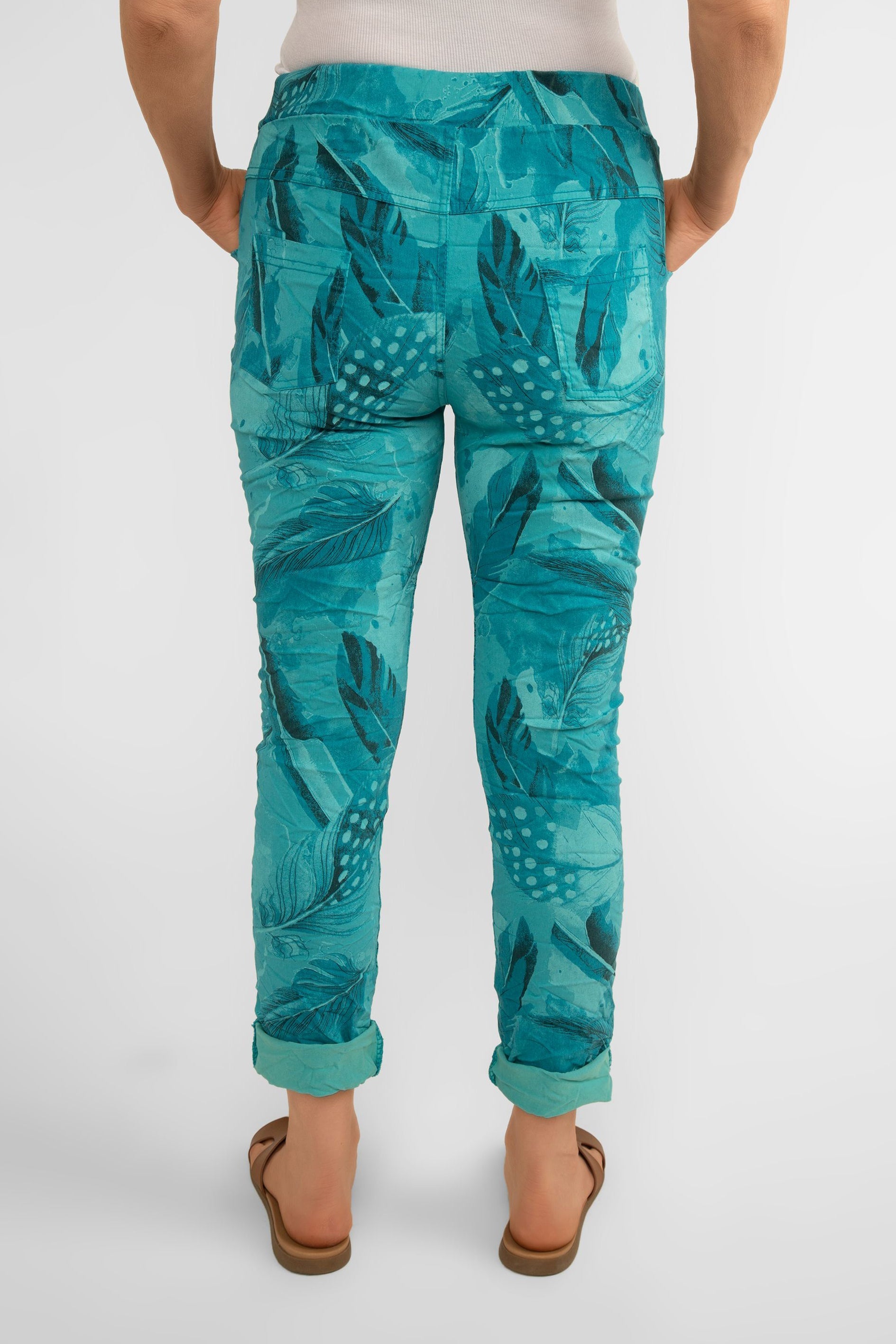 Back view of Bella Amore (21144) Women's Slim Fit Cropped Crinkle Pants with Side Pockets, Pull-on waist in Teal Feather Print