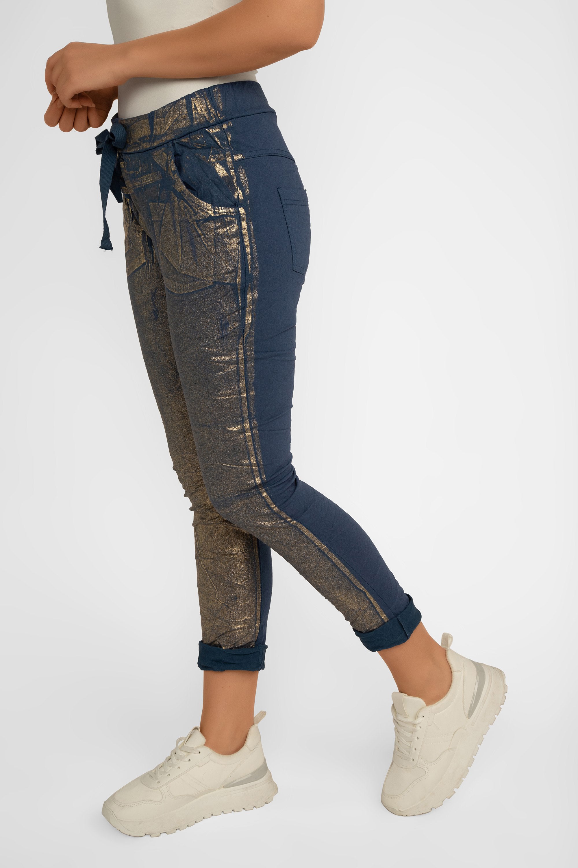 Side view of Bell Amore (21258) Women's Cropped Slim Fit, Metallic Coated Pull On Pants with Pockets in Navy Blue with Gold foil
