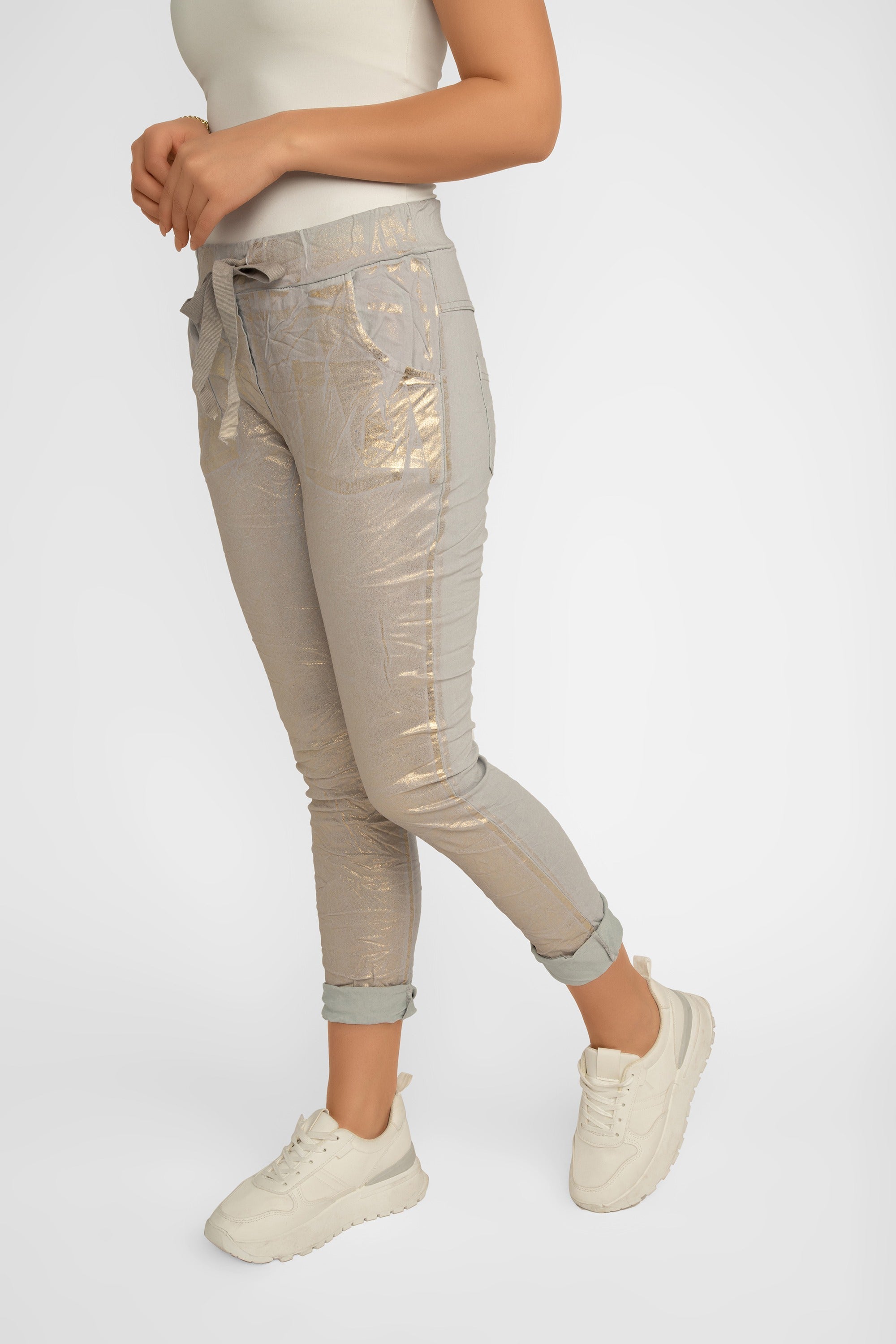 Side view of Bell Amore (21258) Women's Cropped Slim Fit, Metallic Coated Pull On Pants with Pockets in Light Grey with Gold foil