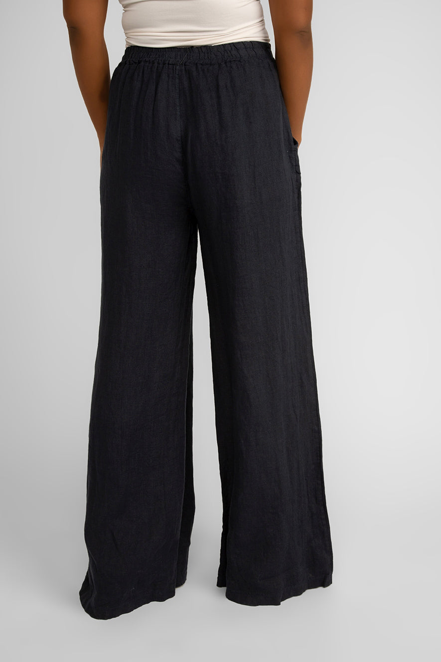 Back view of Carre Noir (6942) Women's Pull On Wide Leg Linen Pants with Pockets in Navy