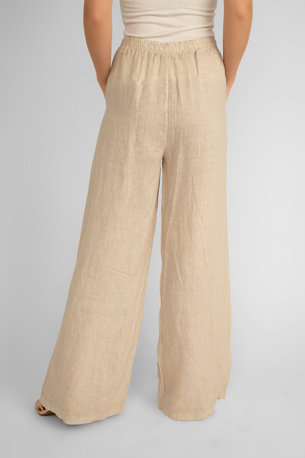 Back view of Carre Noir (6942) Women's Pull On Wide Leg Linen Pants with Pockets in Sand/Beige